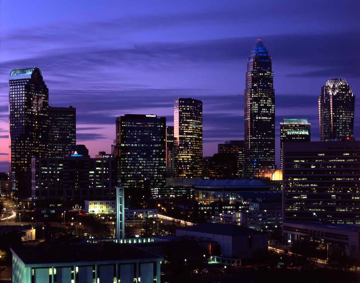 Purple Skies Above Durham's Skyscrapers Background