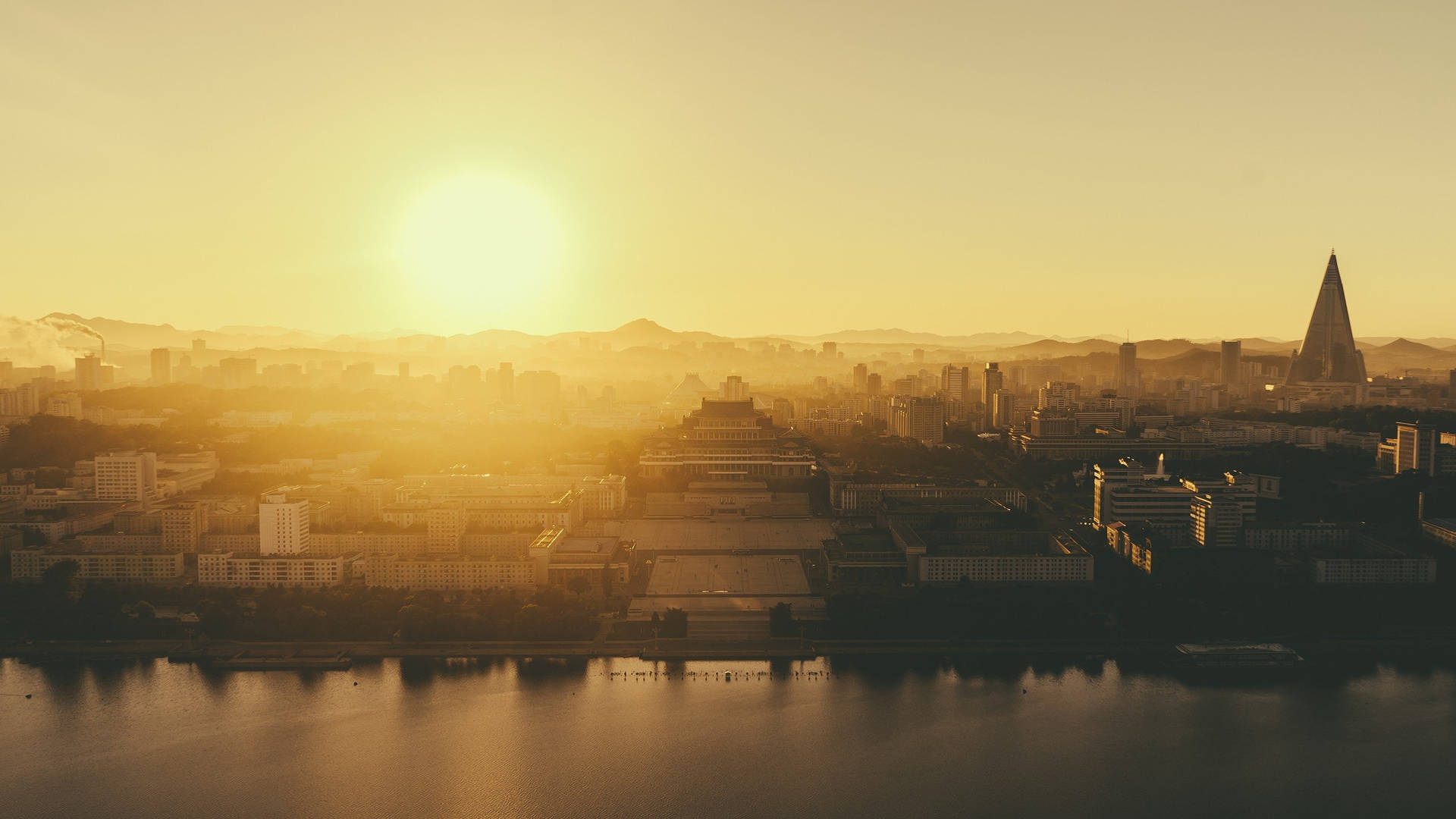 Pyongyang City During Sunset Background