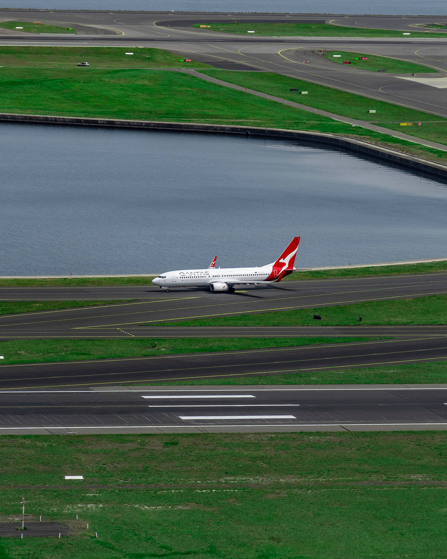 Qantas Aircraft On Runway Background