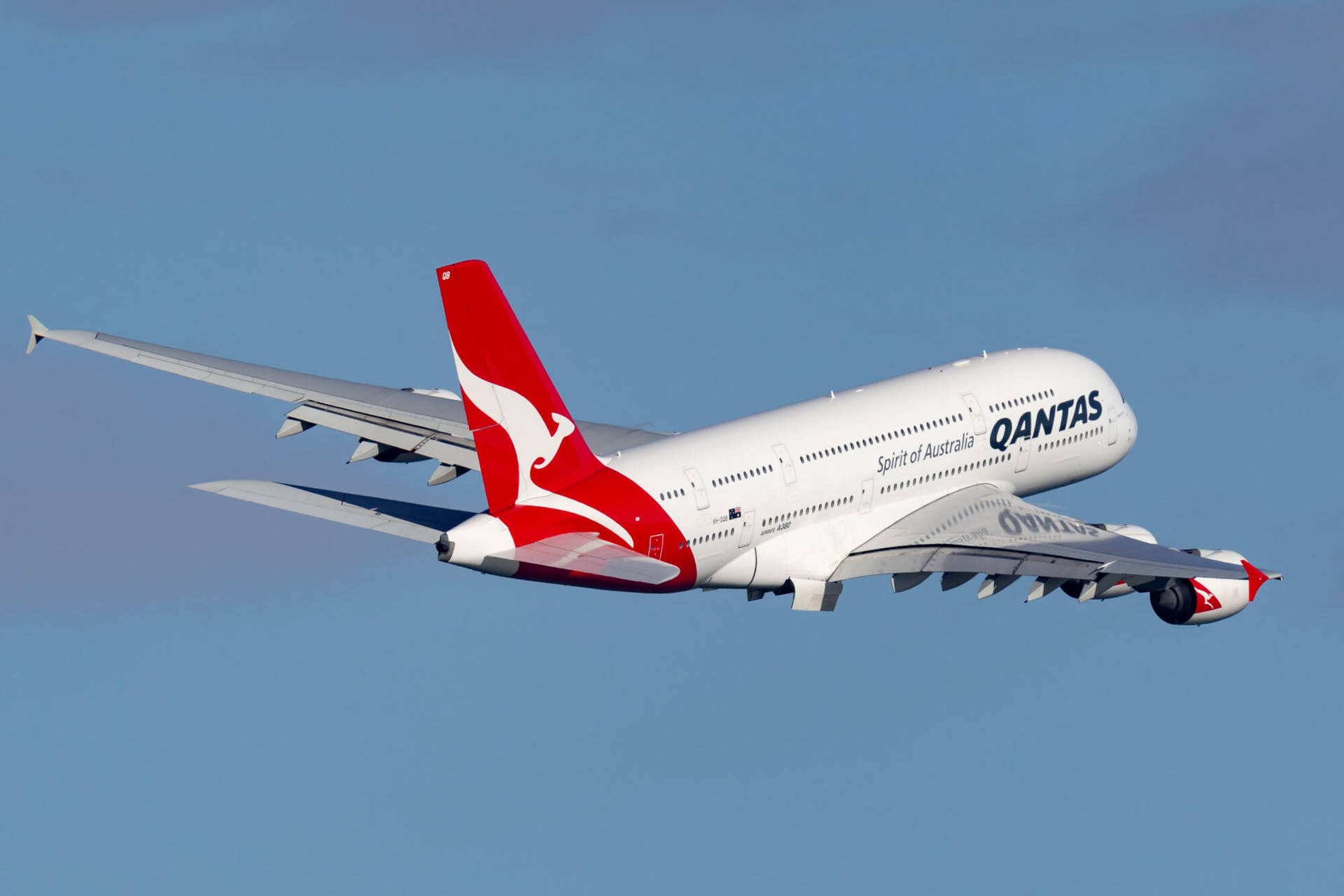 Qantas Airplane In The Blue Sky Background