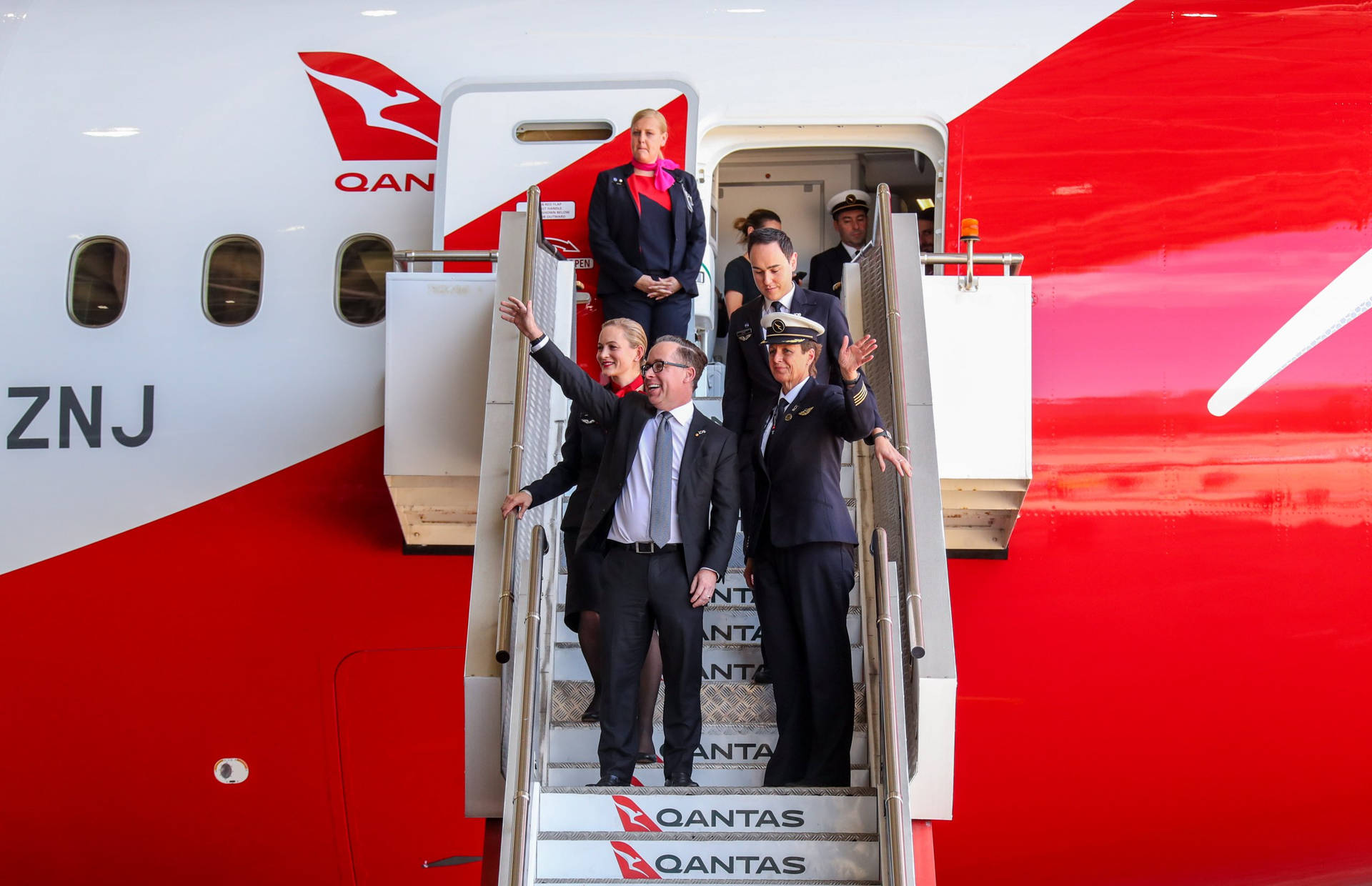 Qantas Airways Ceo Alan Joyce With Cabin Crew Background