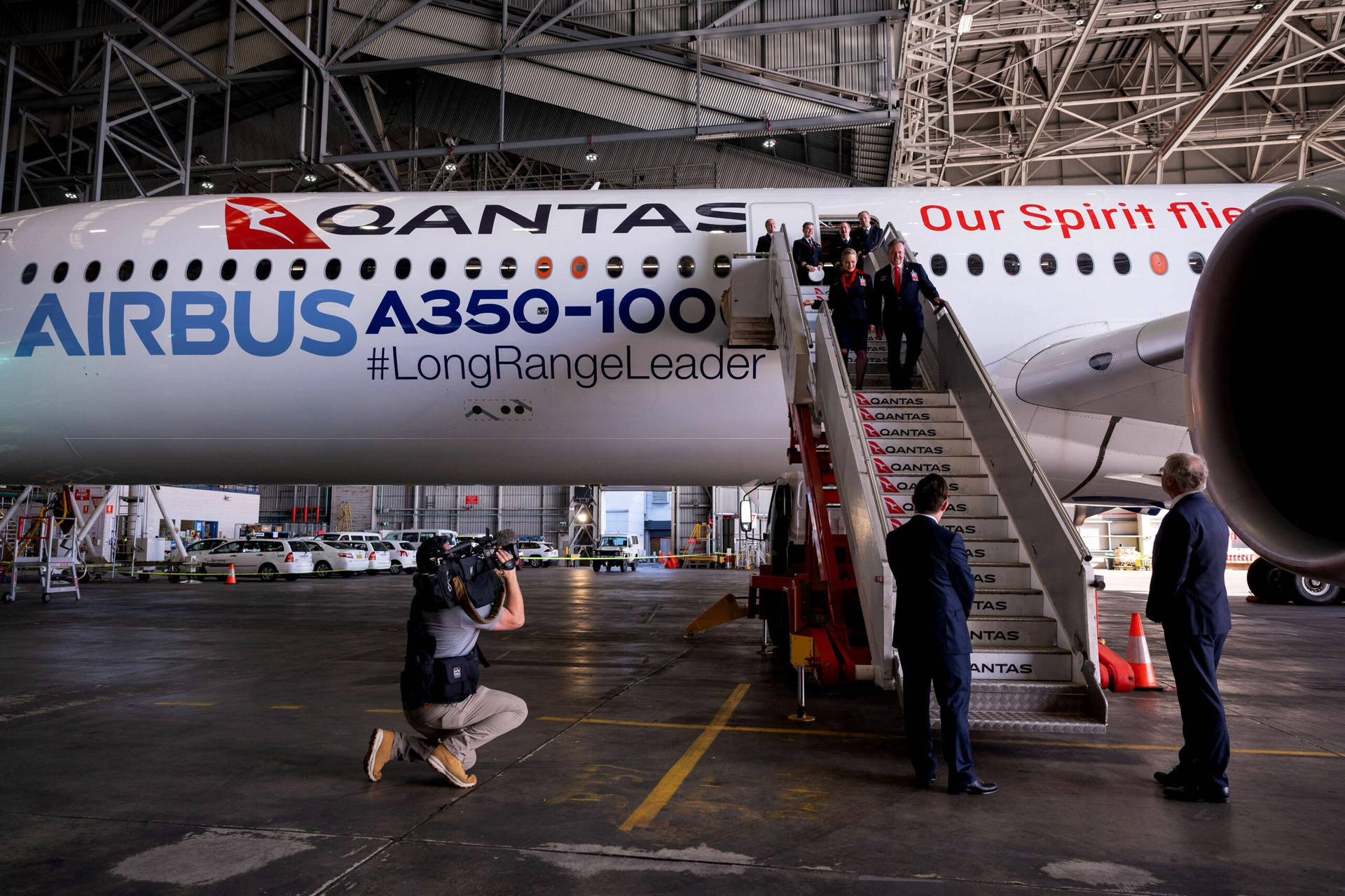 Qantas Airways Executives Posing In Front Of Airbus A350 Background