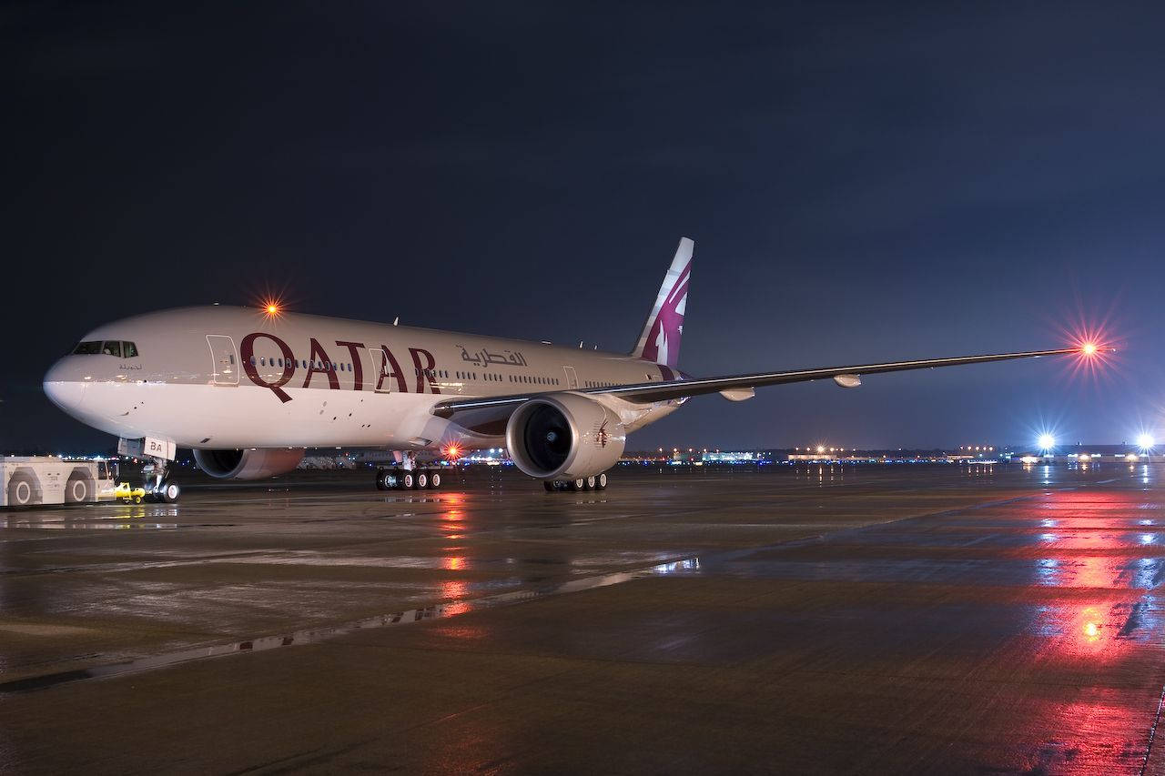 Qatar Airways Plane On The Tarmac Background