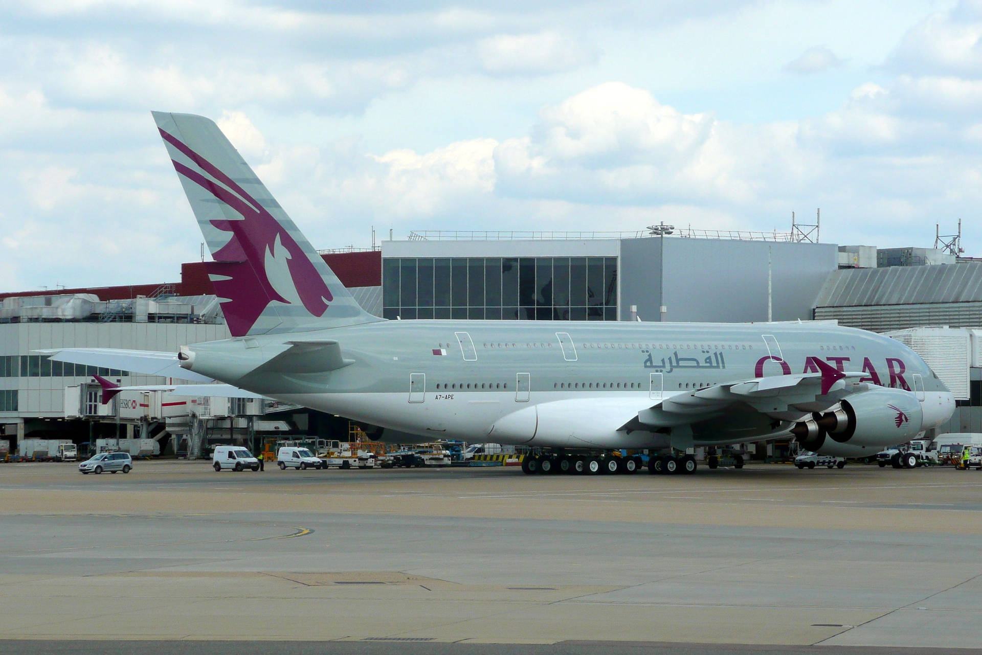 Qatar Airways Taxies On The Runway Background