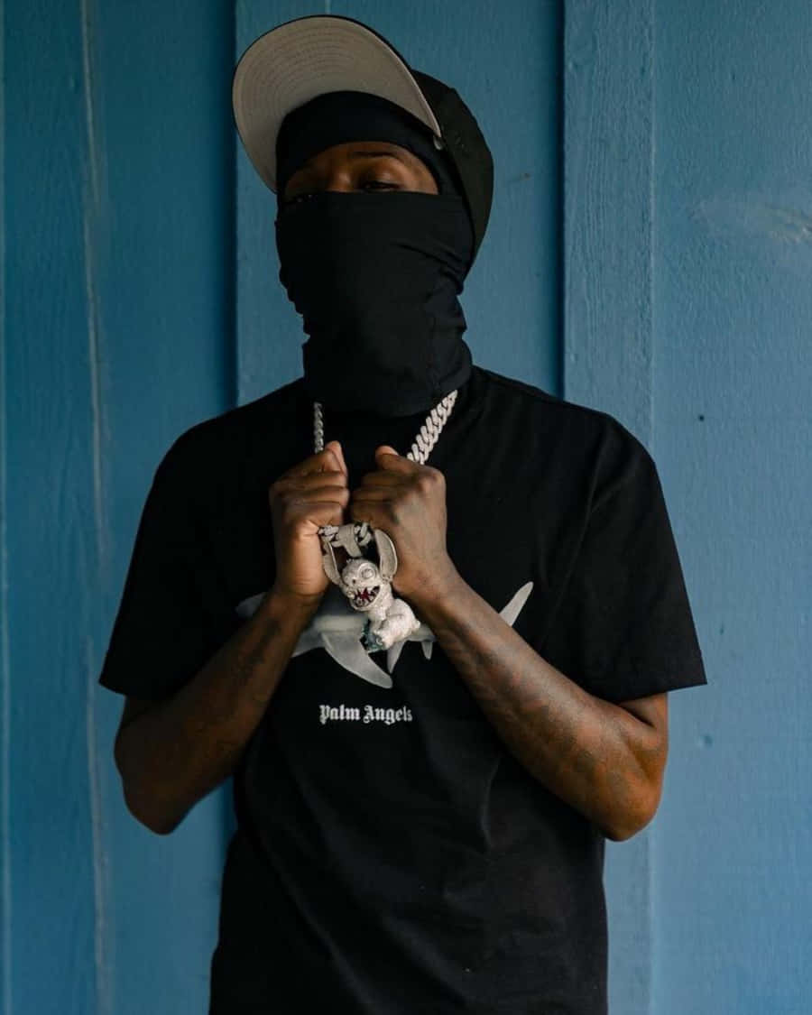 Quando Rondo Posing For A Promotional Photoshoot Background