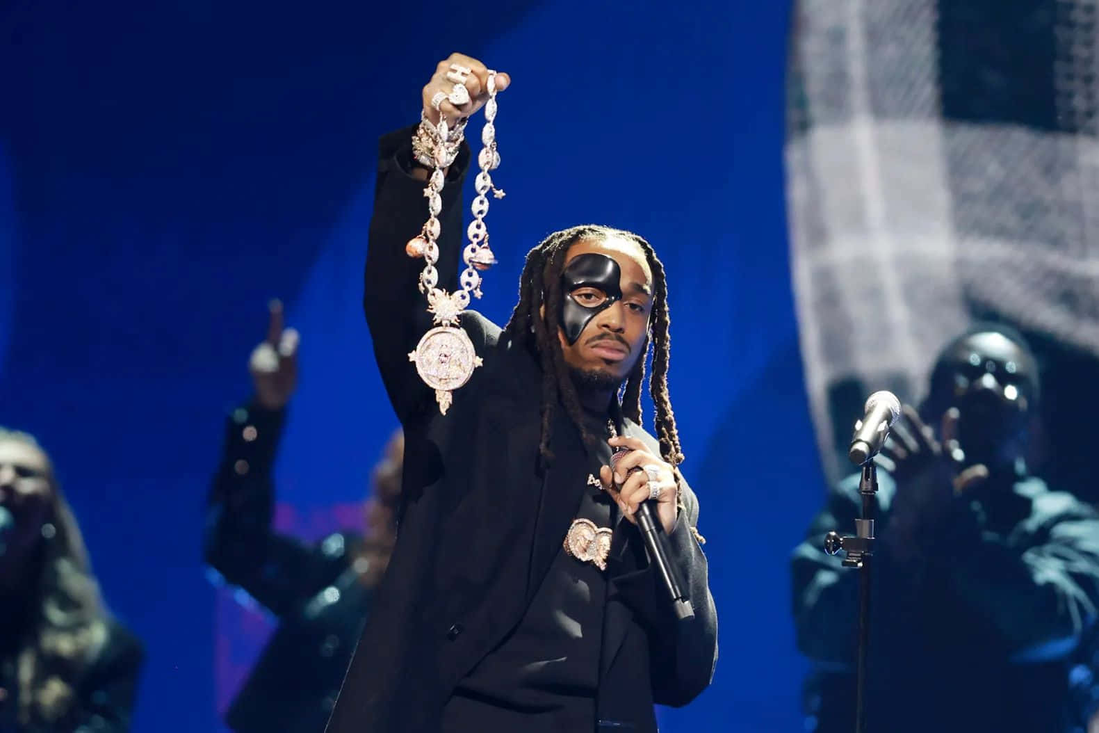 Quavo Performingon Stagewith Mask Background