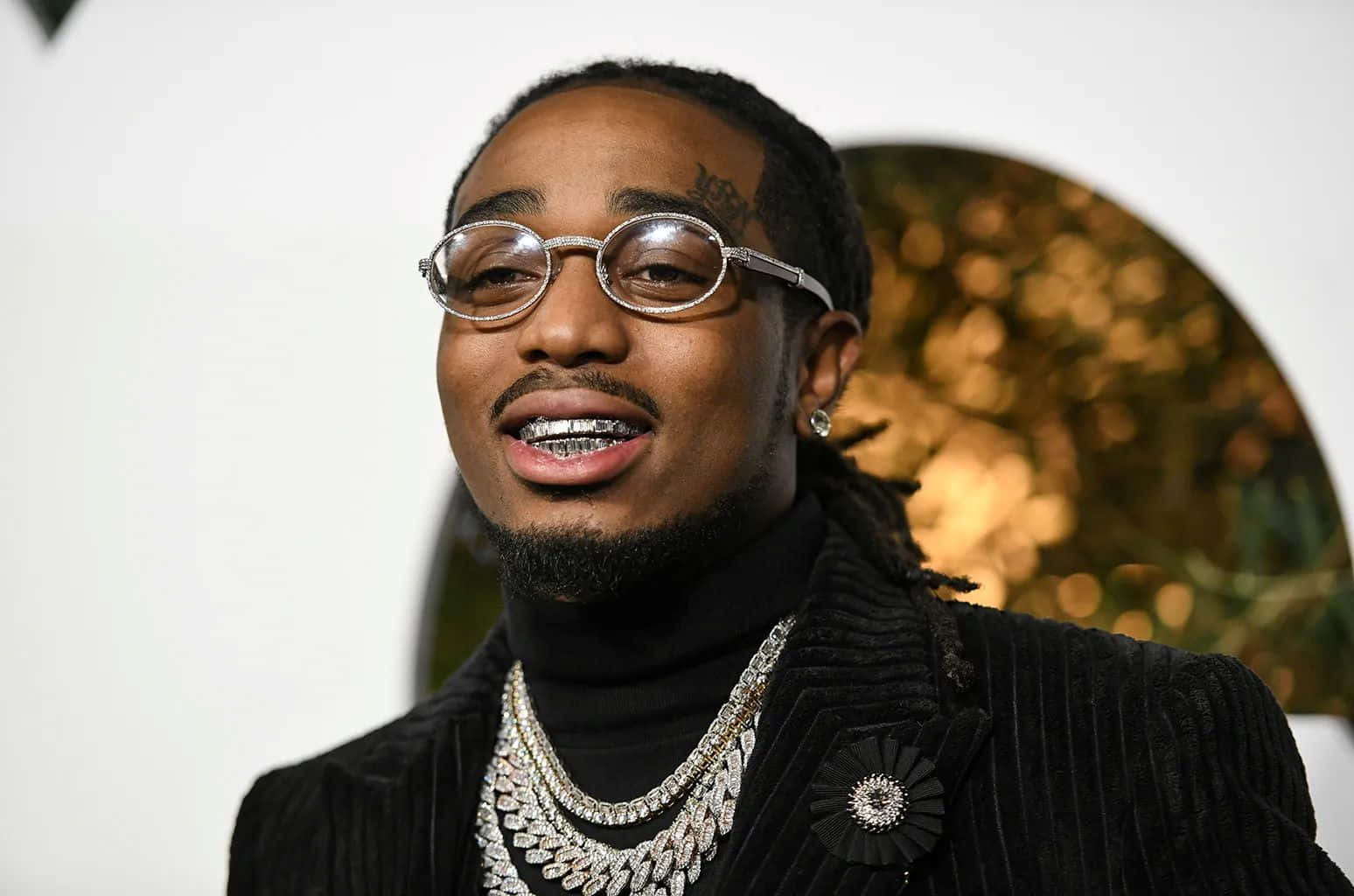 Quavo Smilingwith Jewelry Background