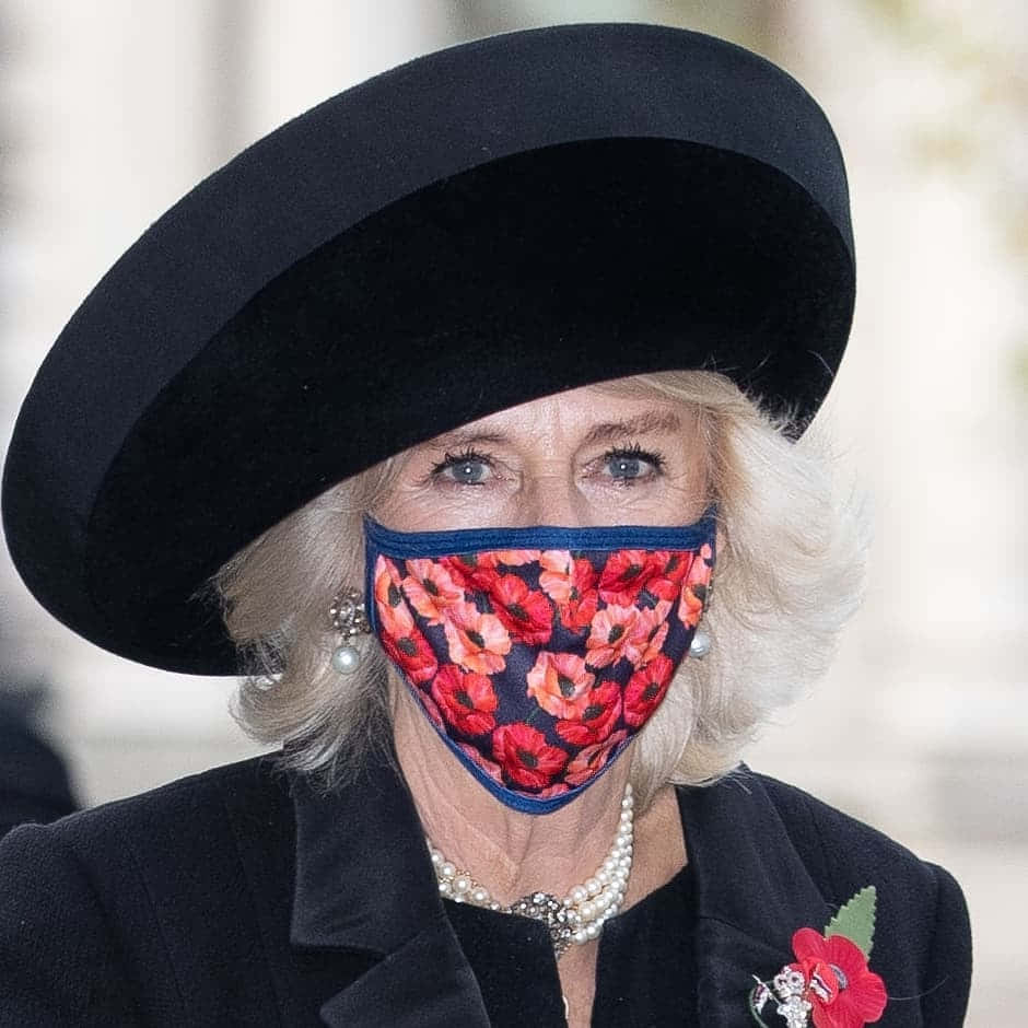 Queen Camilla Donning A Poppy Mask