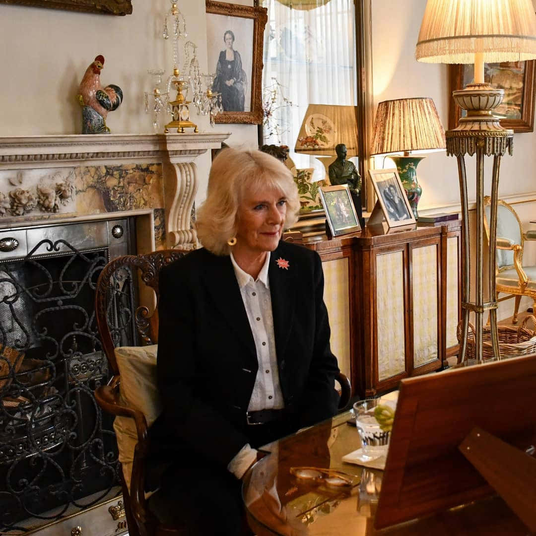 Queen Camilla Sitting Behind Desk