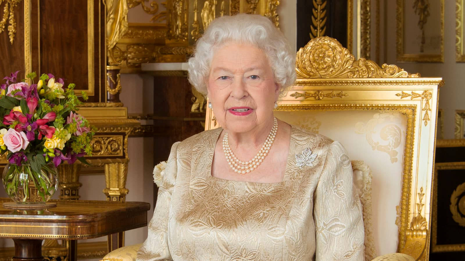 Queen Elizabeth In Gold Outfit