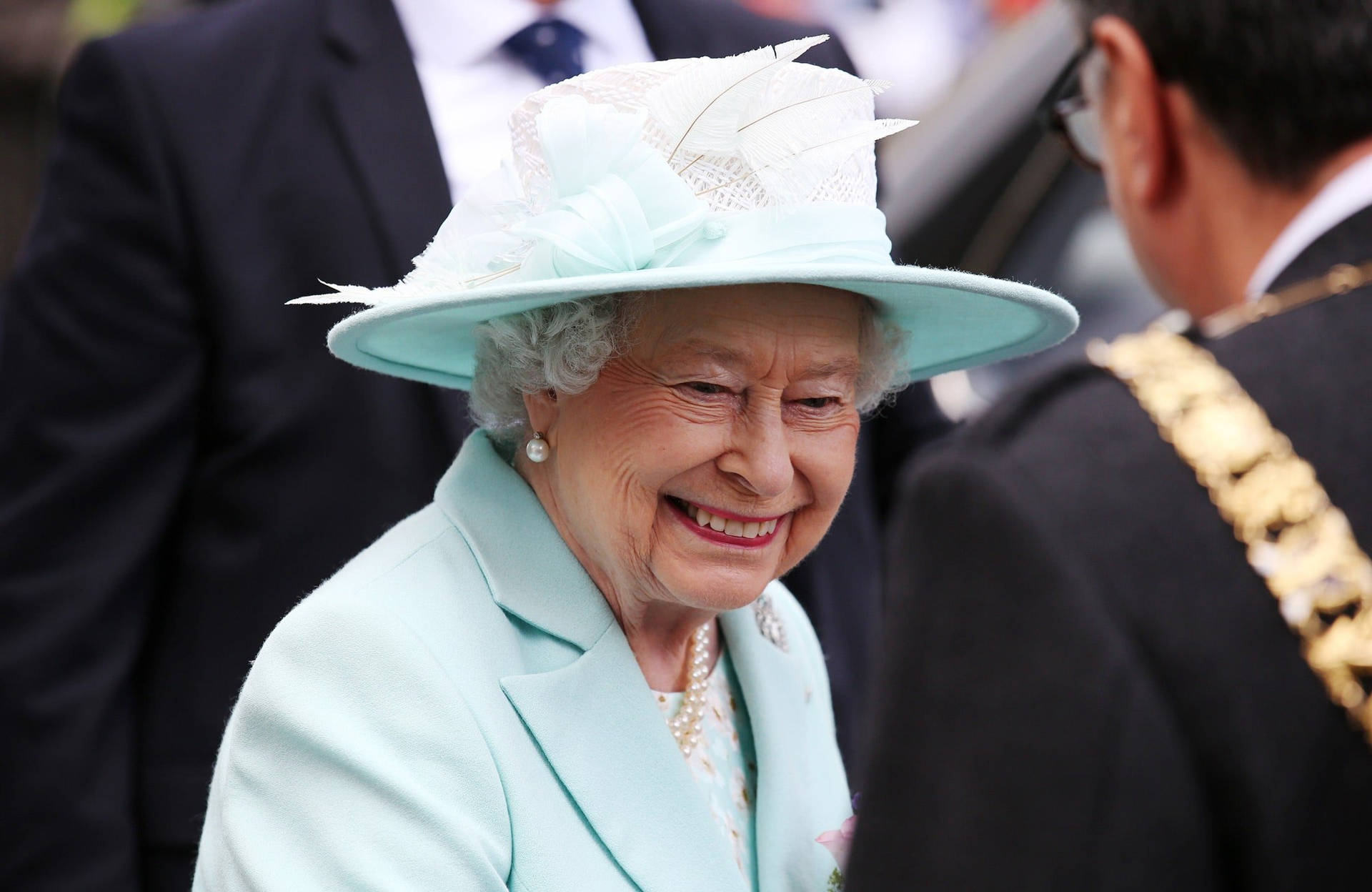 Queen Elizabeth In Light Blue Dress Background