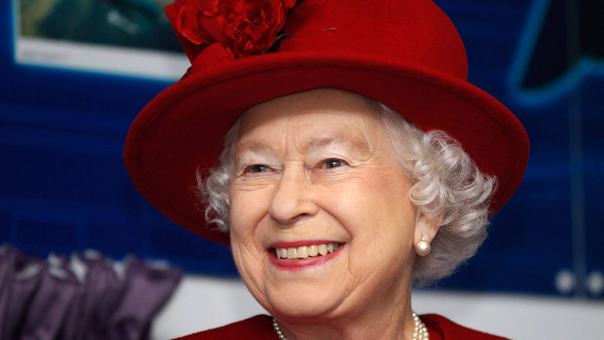 Queen Elizabeth Wearing Red Hat Background