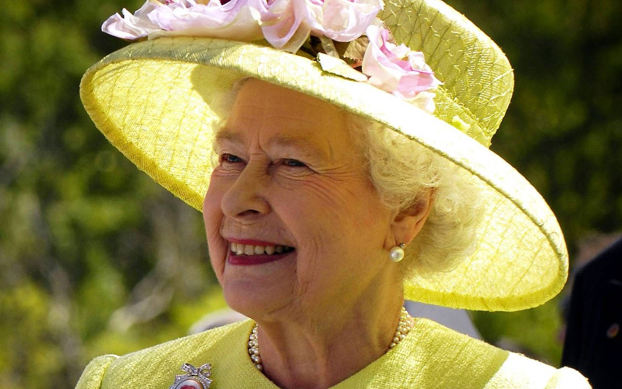 Queen Elizabeth Wearing Yellow Hat Background