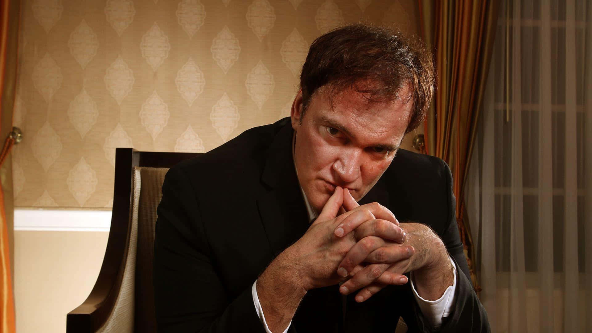 Quentin Tarantino Contemplative Pose Background