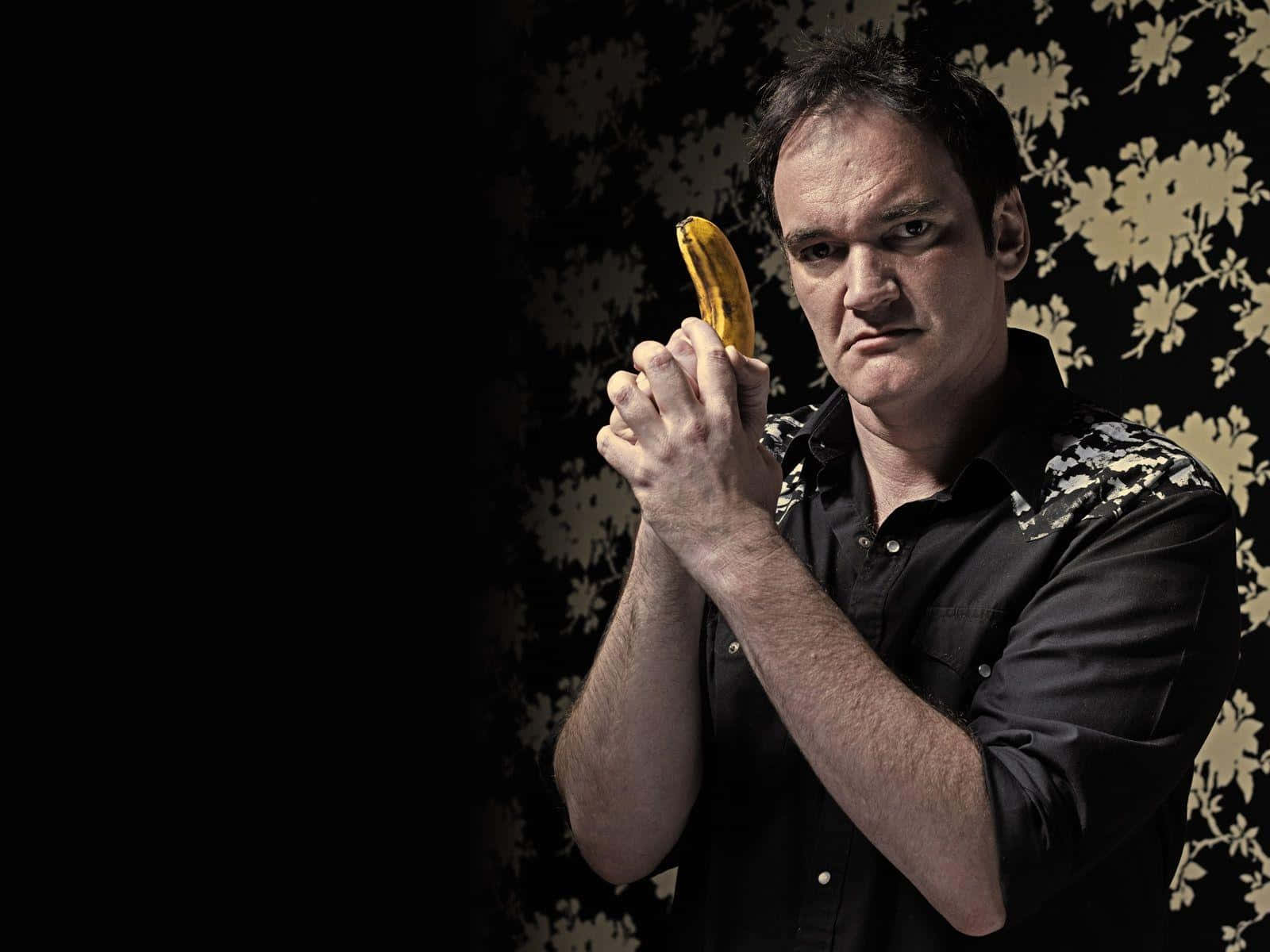 Quentin_ Tarantino_ Holding_ Banana Background
