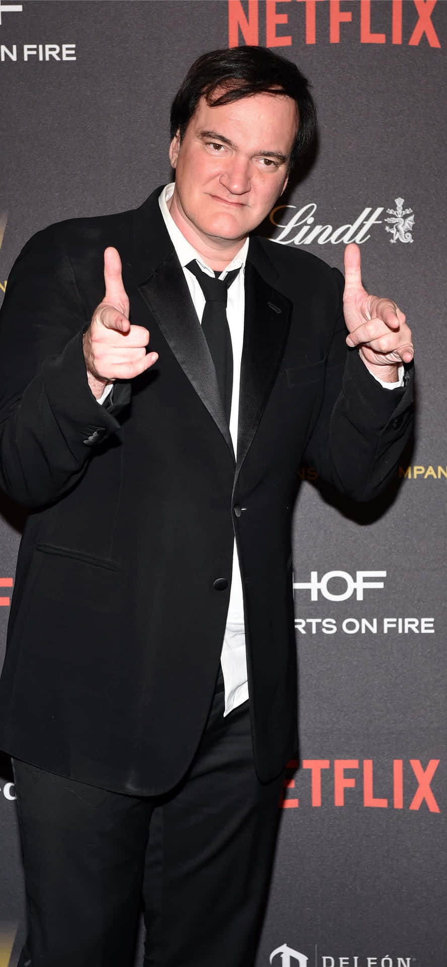 Quentin_ Tarantino_ Pointing_ Gesture_at_ Event Background