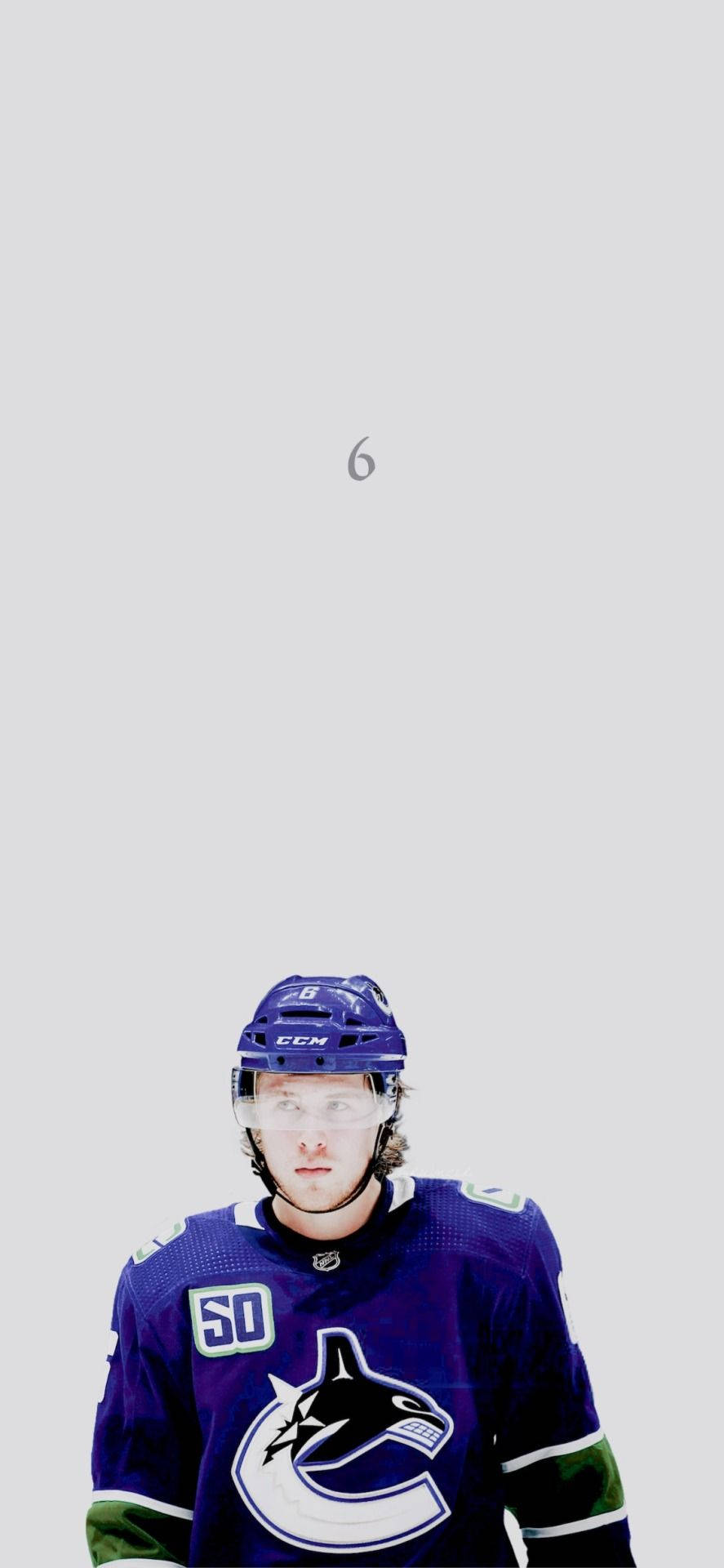 Quinn Hughes Looking In Front With White Background Background