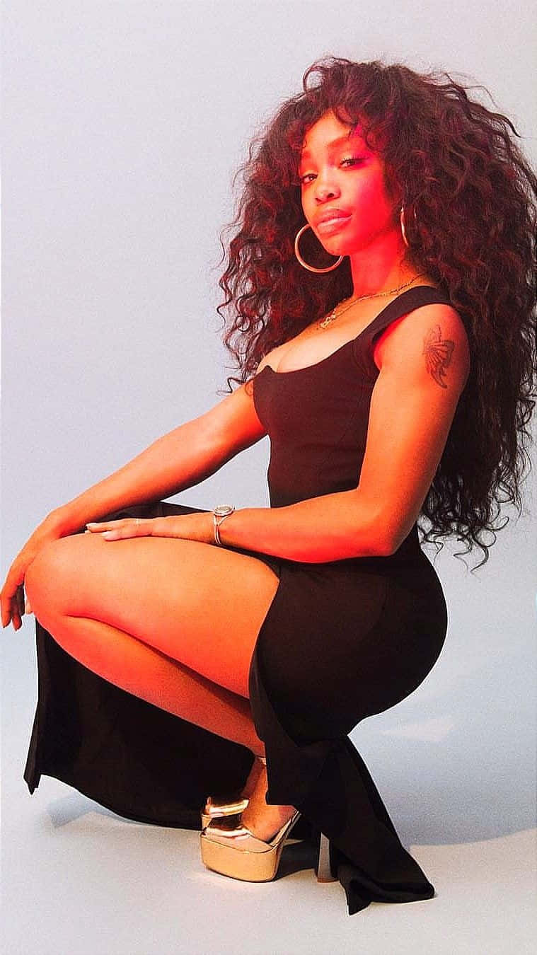 R&b Artist Sza Expressing Her Passion For Music Background