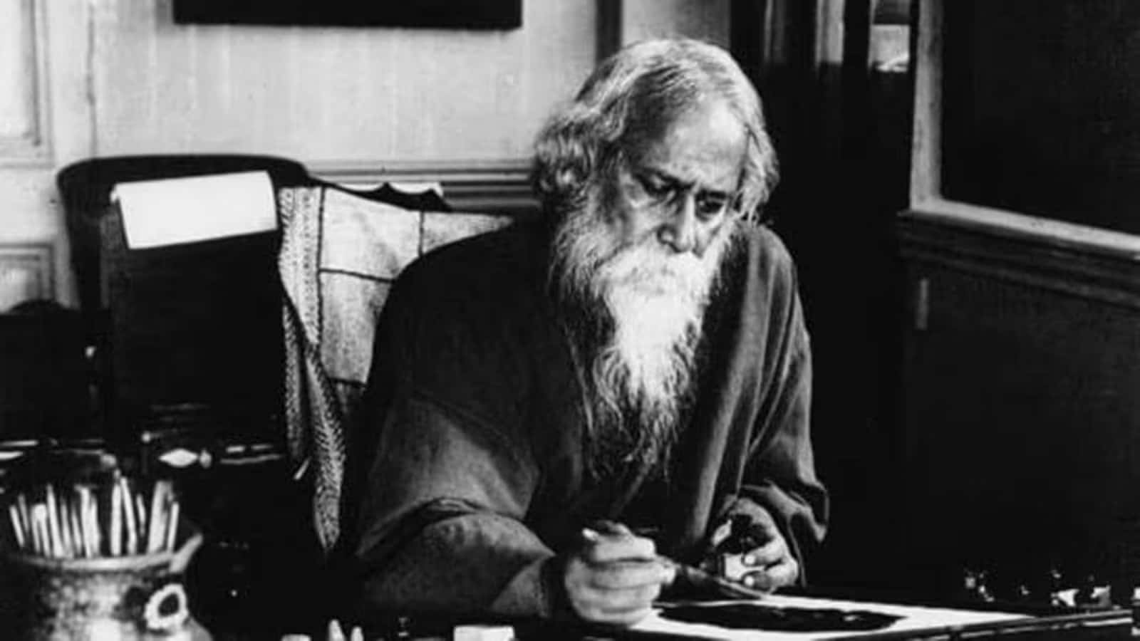 Rabindranath Tagore Writingat Desk Background