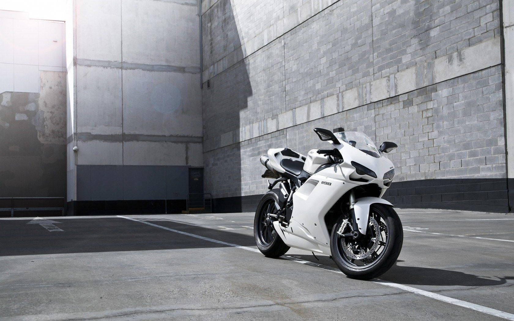 Race Ready: A Striking White Ducati 1198 Motor Bike Background
