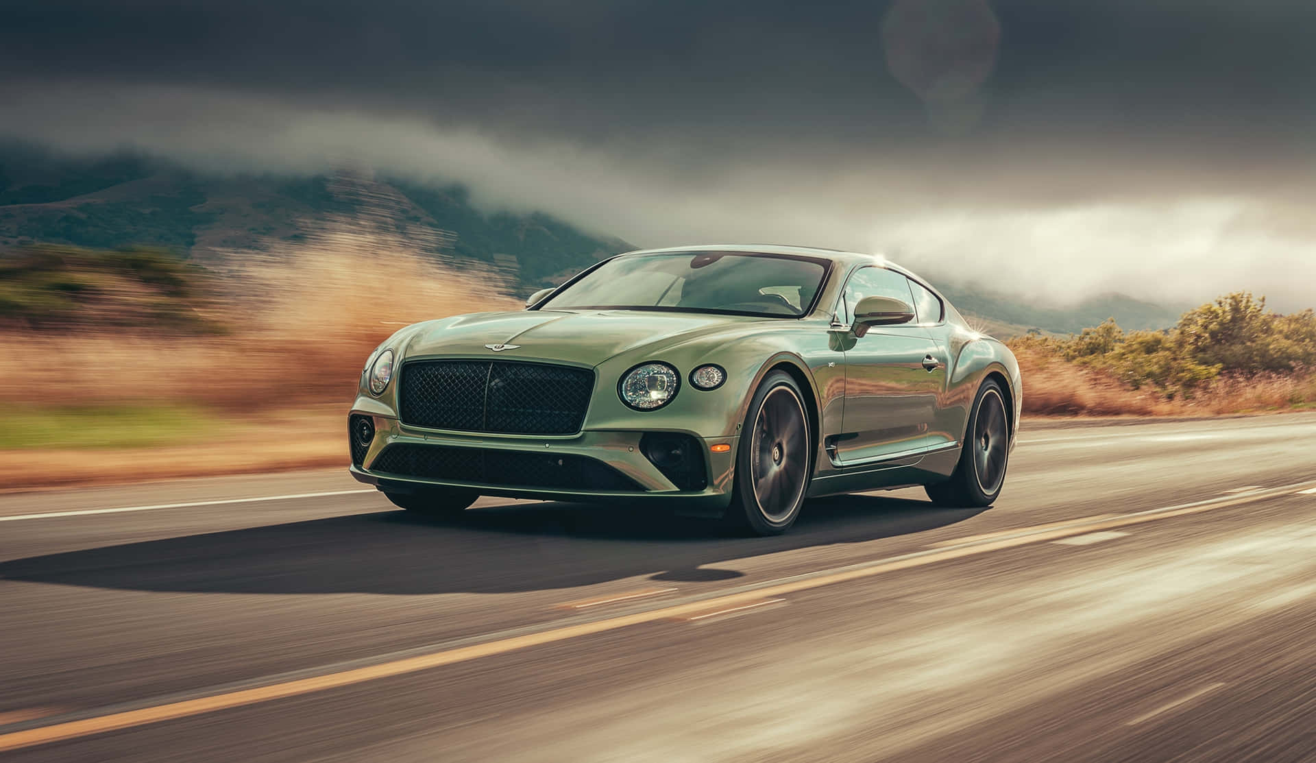 Race To The Top In The Bentley Sport Background
