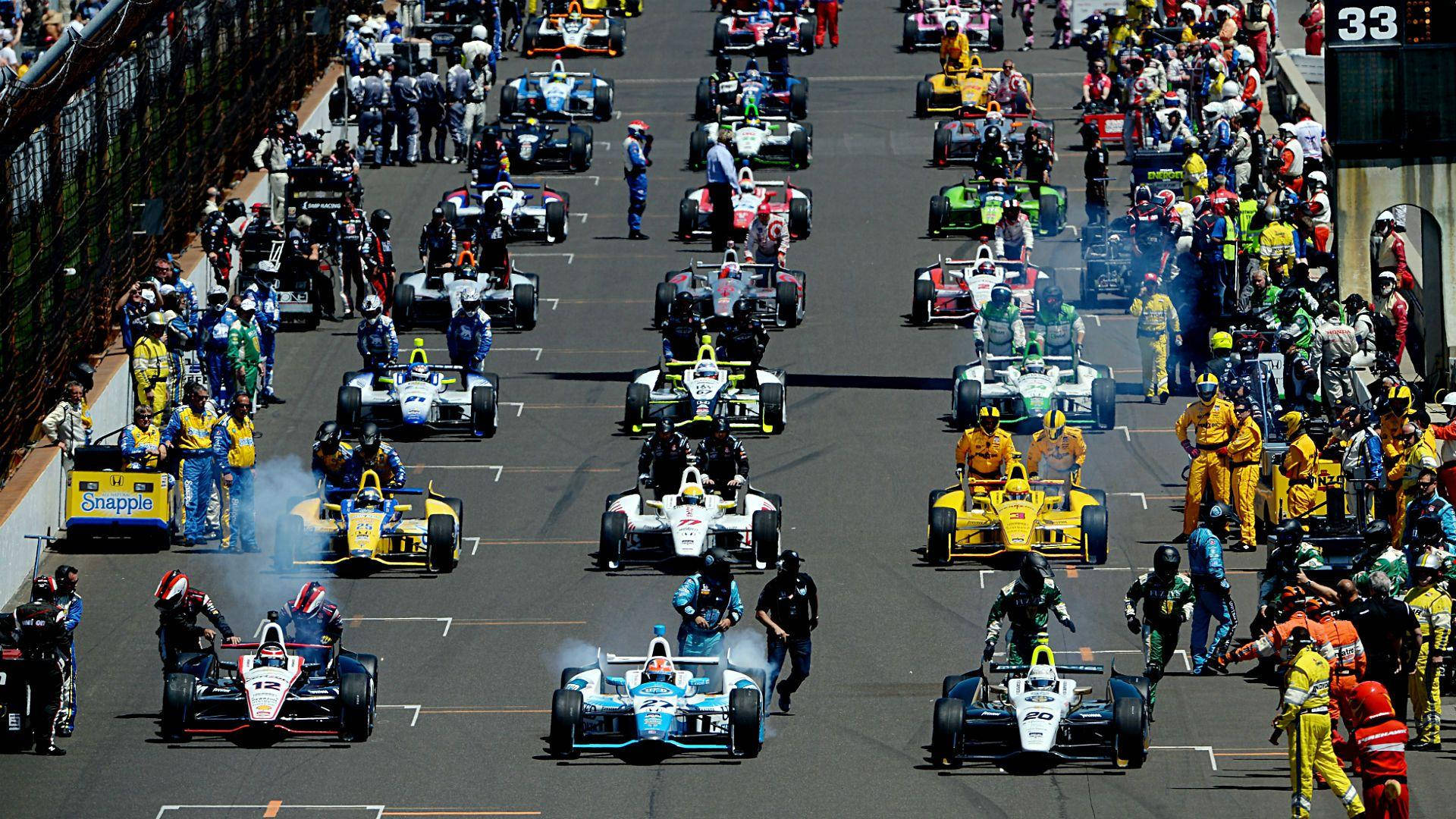 Racing Cars In Indianapolis 500 Background
