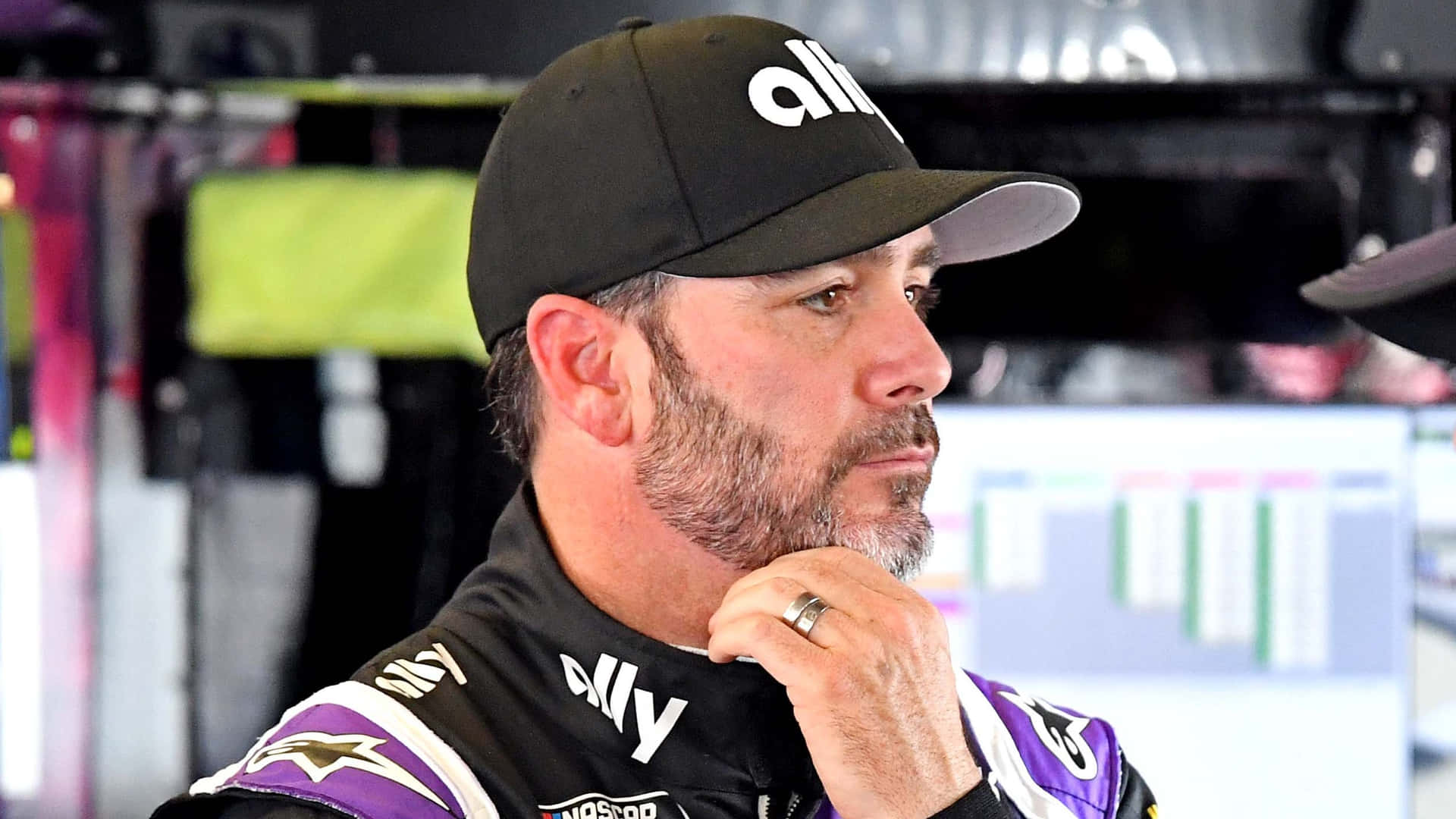 Racing Legend Jimmie Johnson In Action On The Track Background