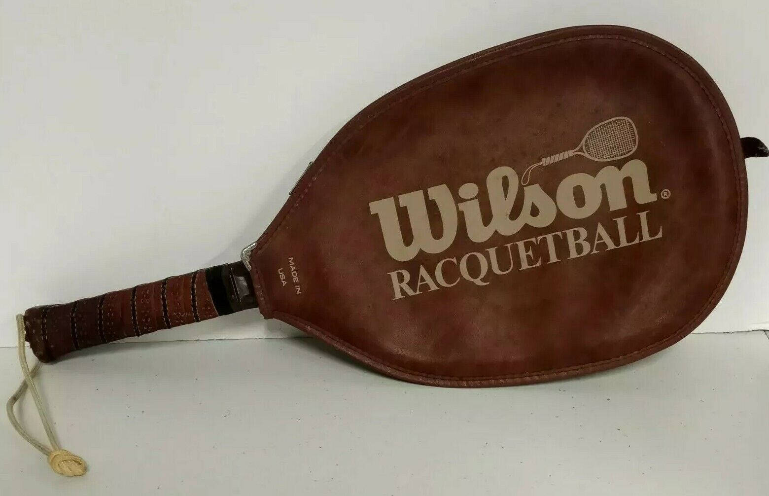 Racquetball Racket In Leather Wilson Jacket Background