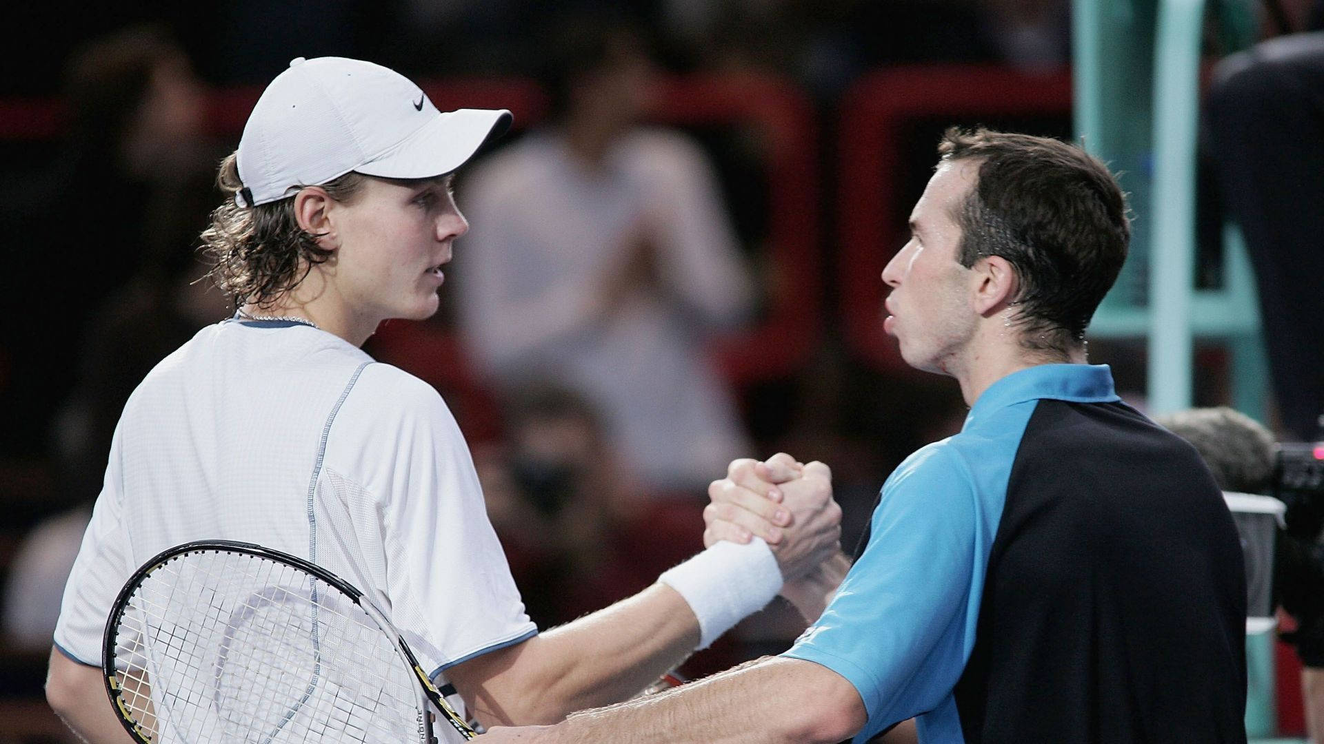 Radek Stepanek And Tomas Berdych Celebratory Handshake After A Match Background