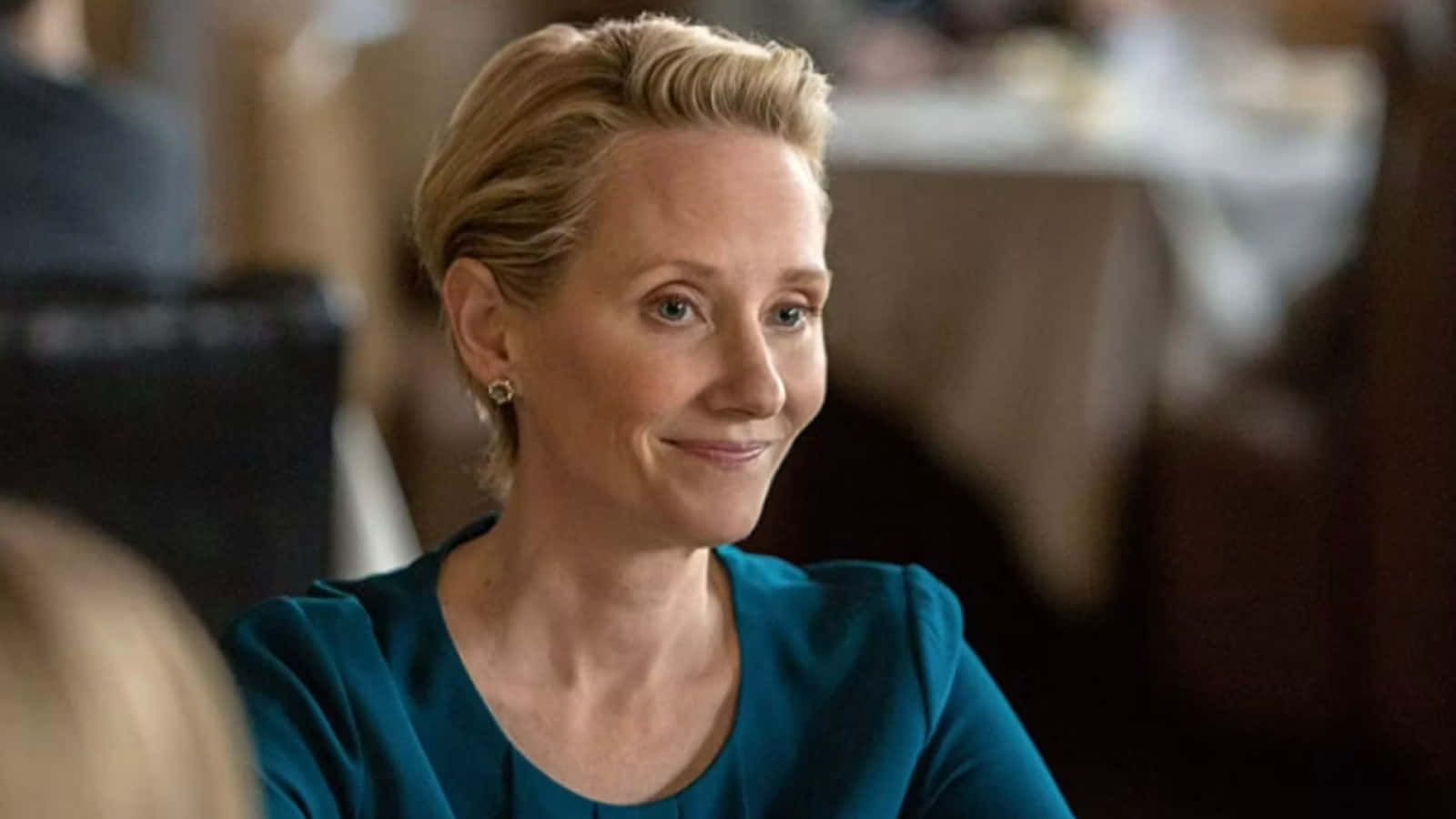Radiant Anne Heche Sporting A Short Hairstyle Background