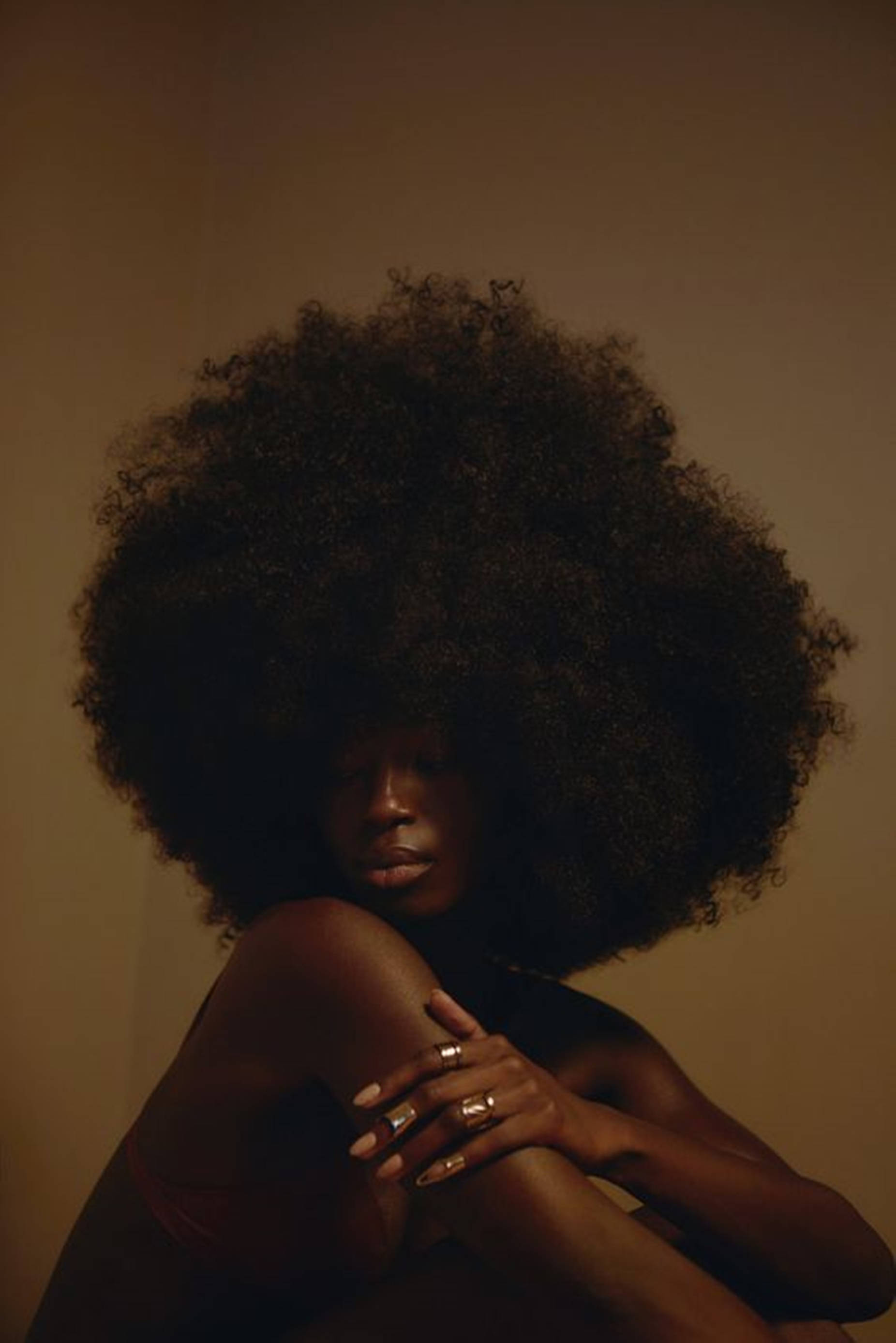 Radiant Beauty: Stunning Black Woman With Gorgeous Hair Background