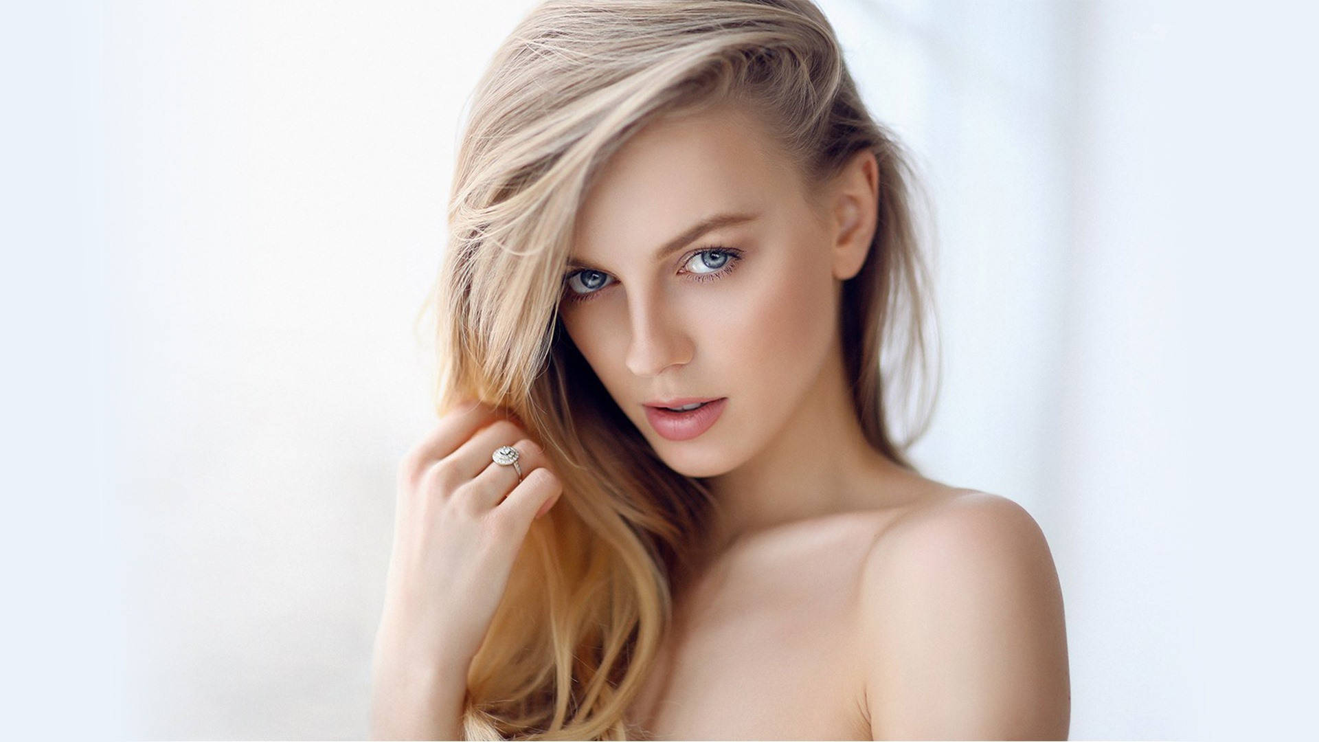 Radiant Blonde Woman With Captivating Eyes