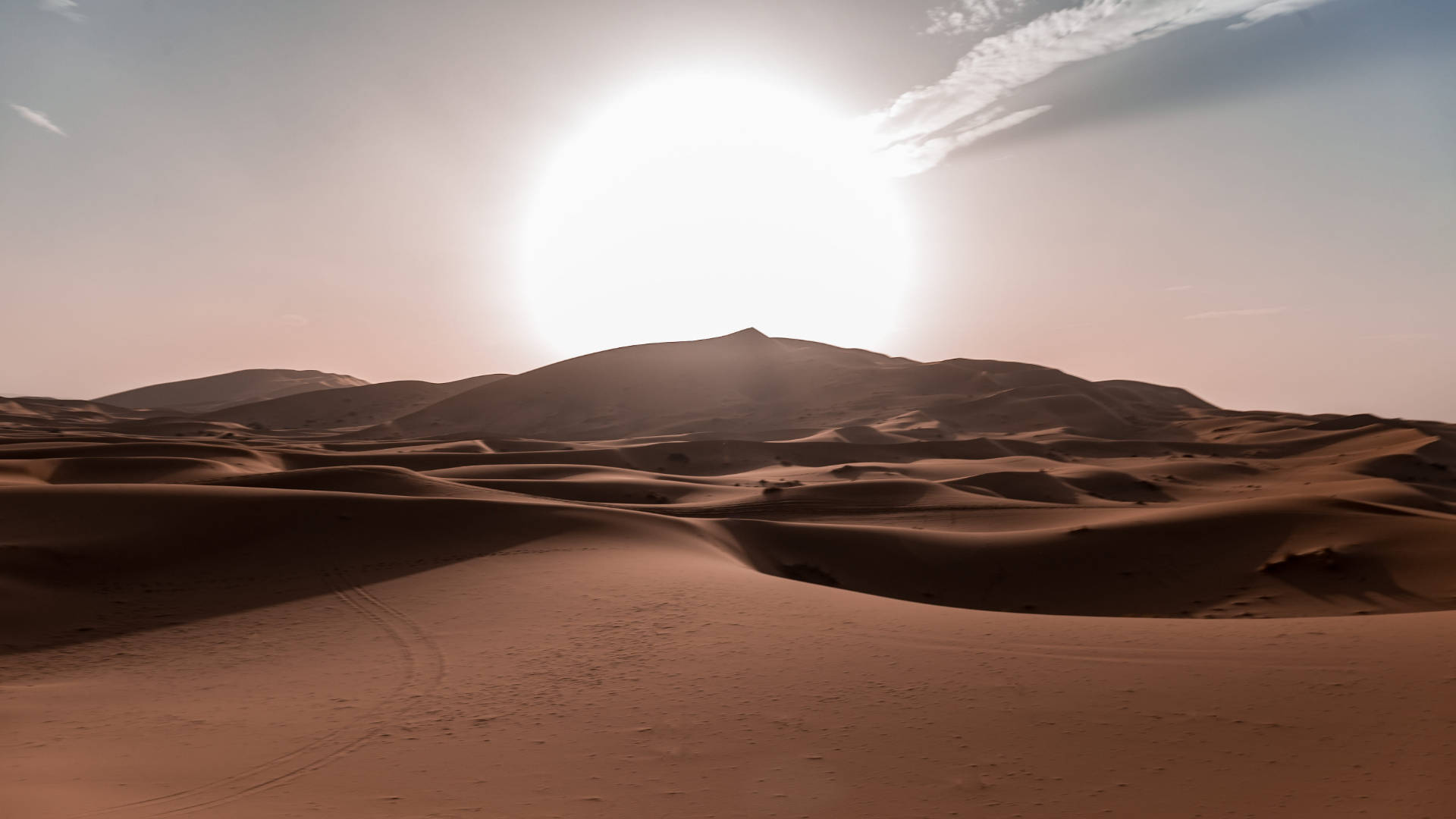 Radiant Desert Sun Against A Pristine Sky Background