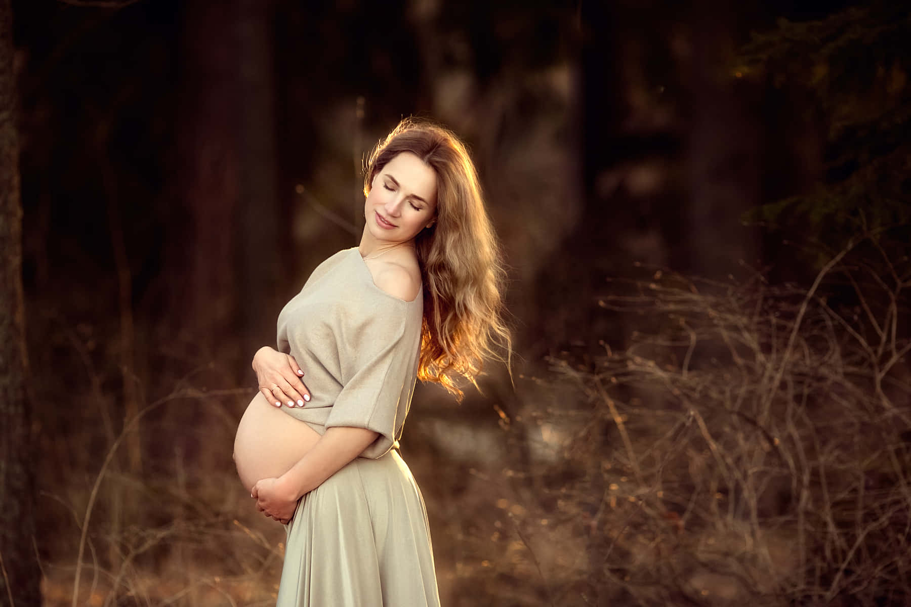 Radiant Expecting Mother With Baby Bump Background