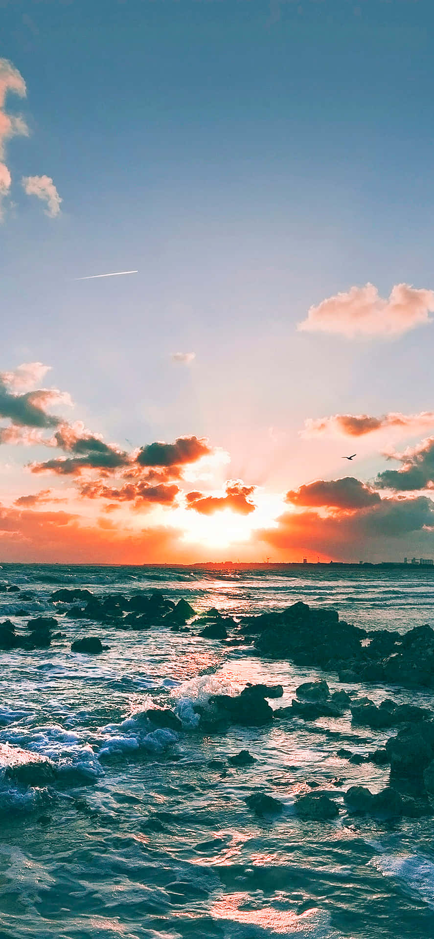 Radiant Sunset Cloud Over A Tranquil Ocean Background