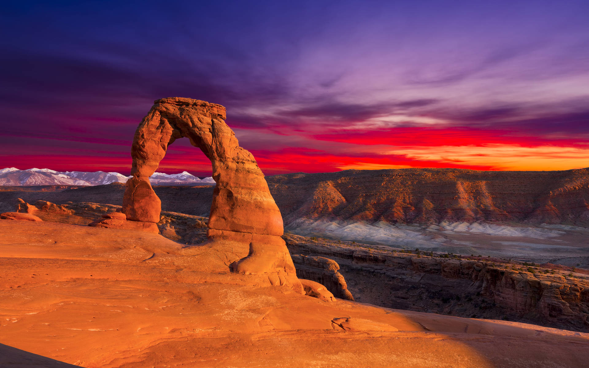 Radiant Sunset Over Arches National Park Background