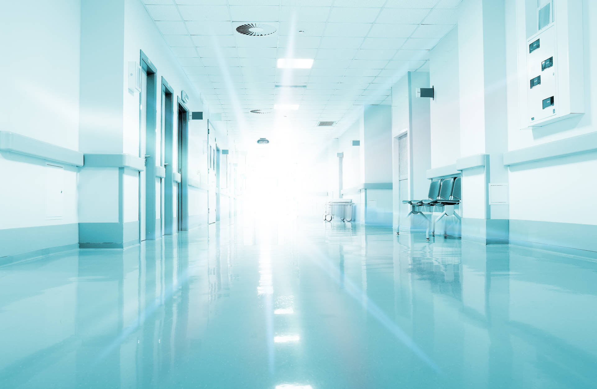 Radiant White Hospital Hallway Background