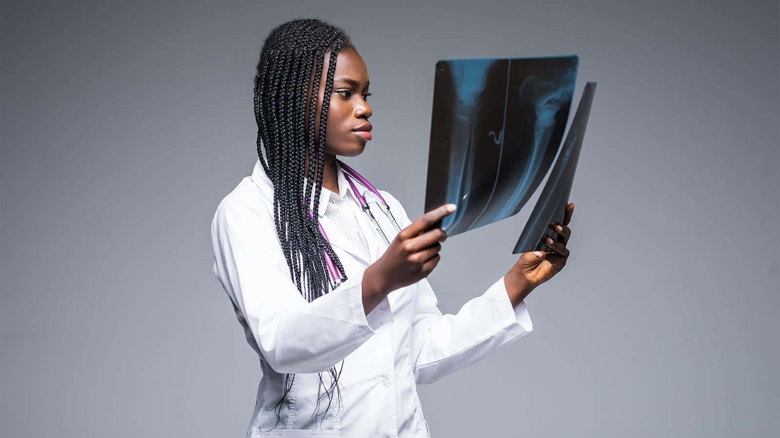 Radiant Young Black Woman With X-rays In A Medical Setting Background