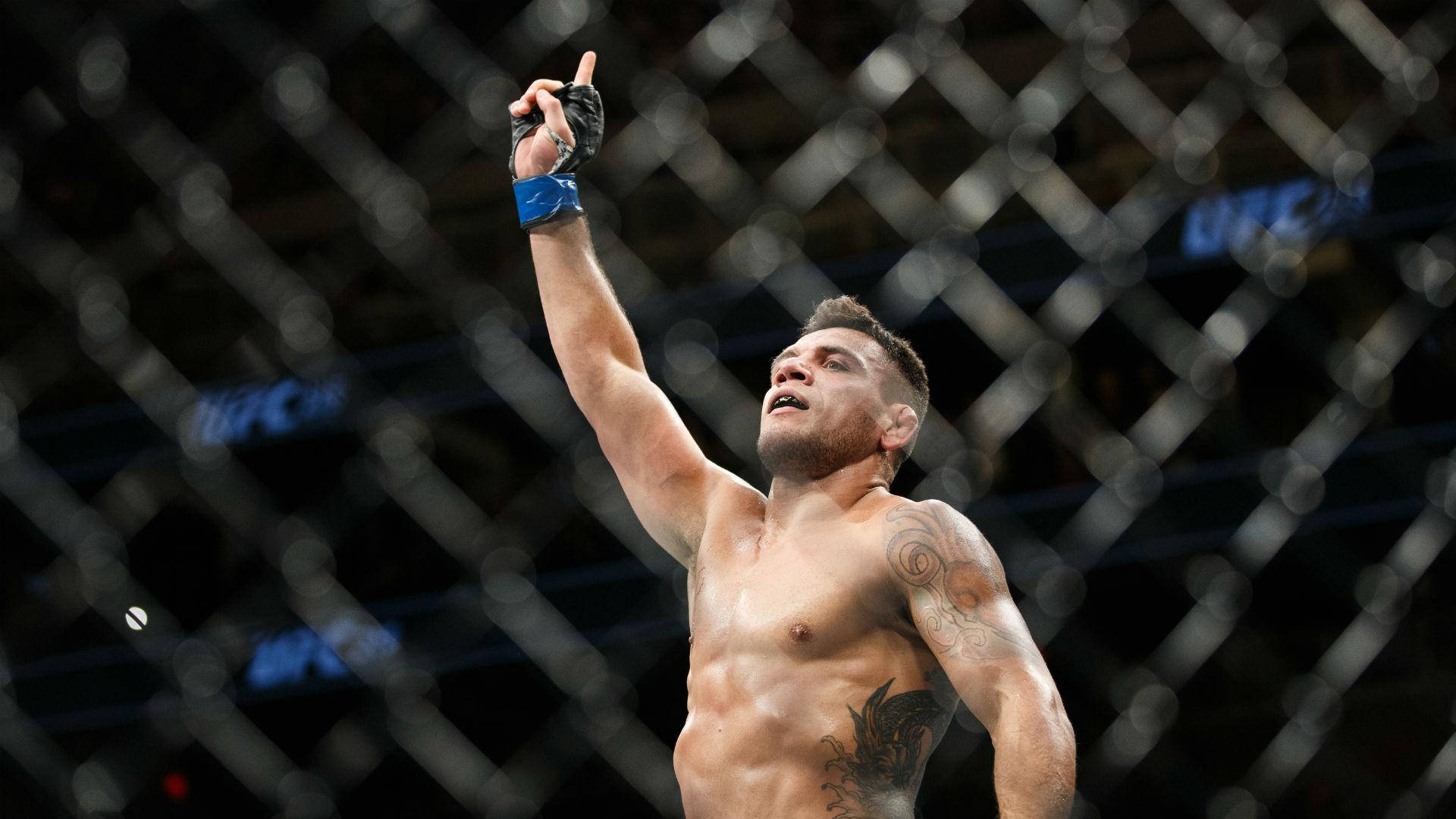 Rafael Dos Anjos Confidently Pointing Upwards Background