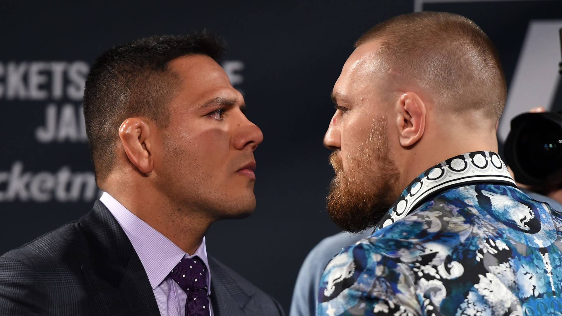 Rafael Dos Anjos Conor Mcgregor Intense Gaze Background