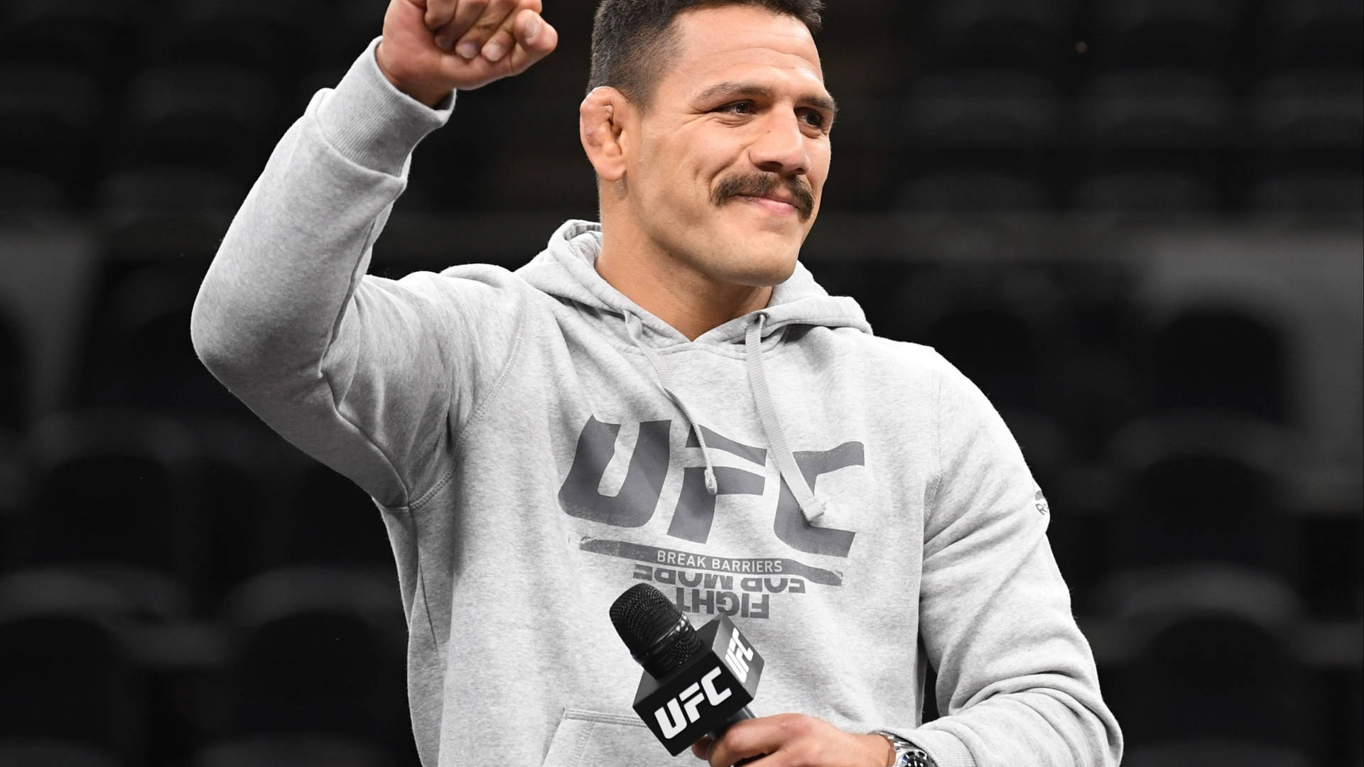 Rafael Dos Anjos Wearing Gray Jacket Background