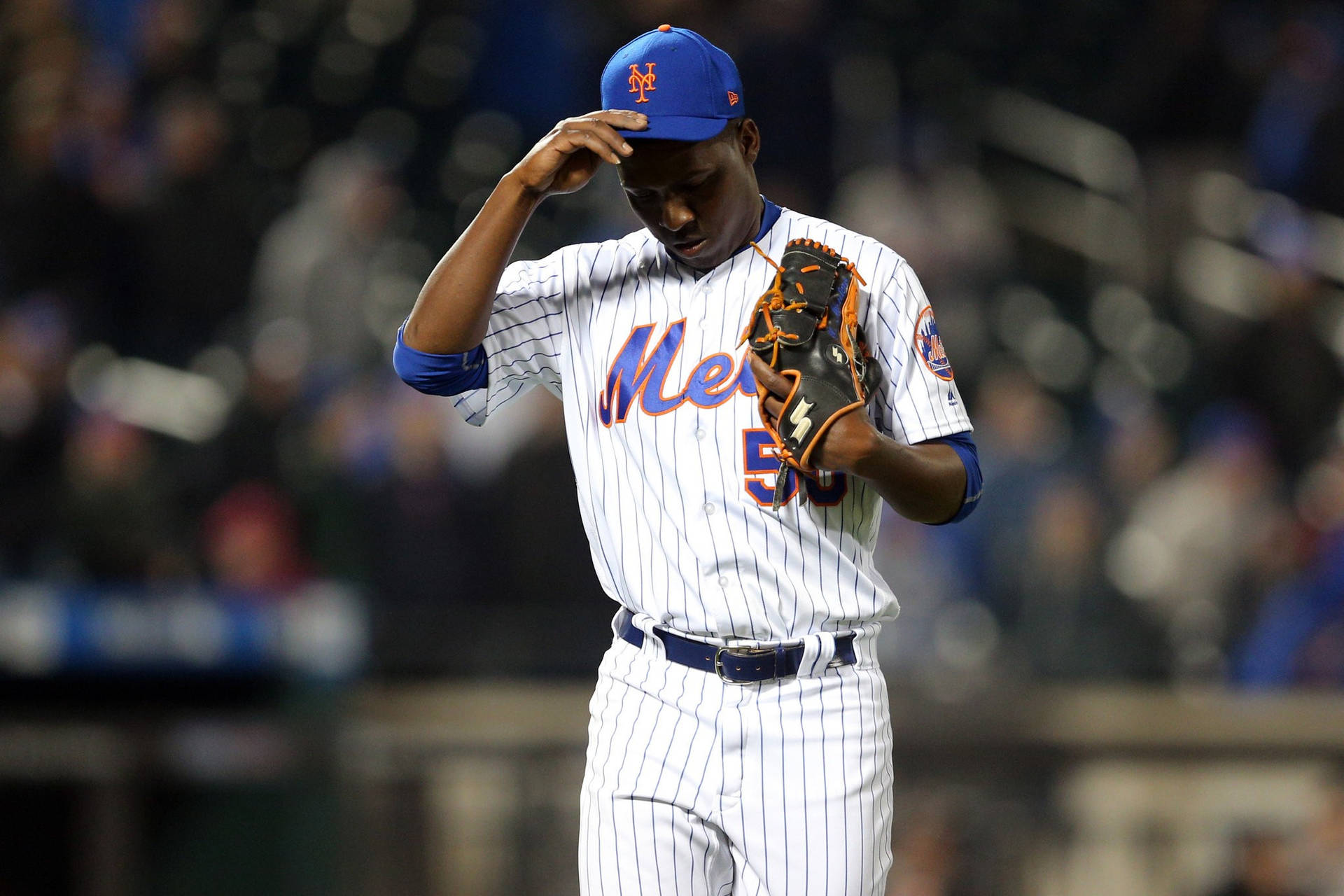 Rafael Montero Fixing His Cap Background