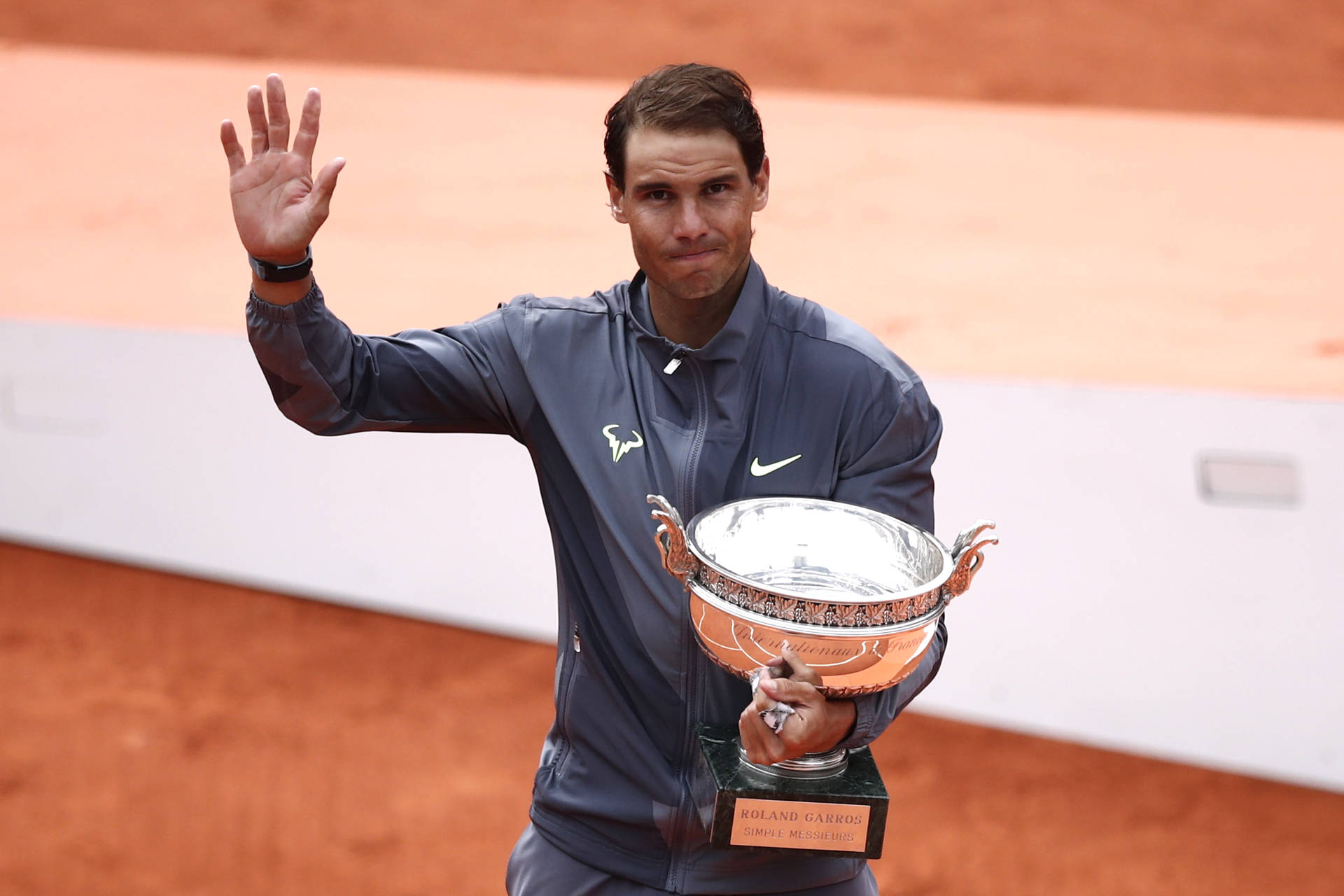Rafael Nadal Holding Silver Trophy Background