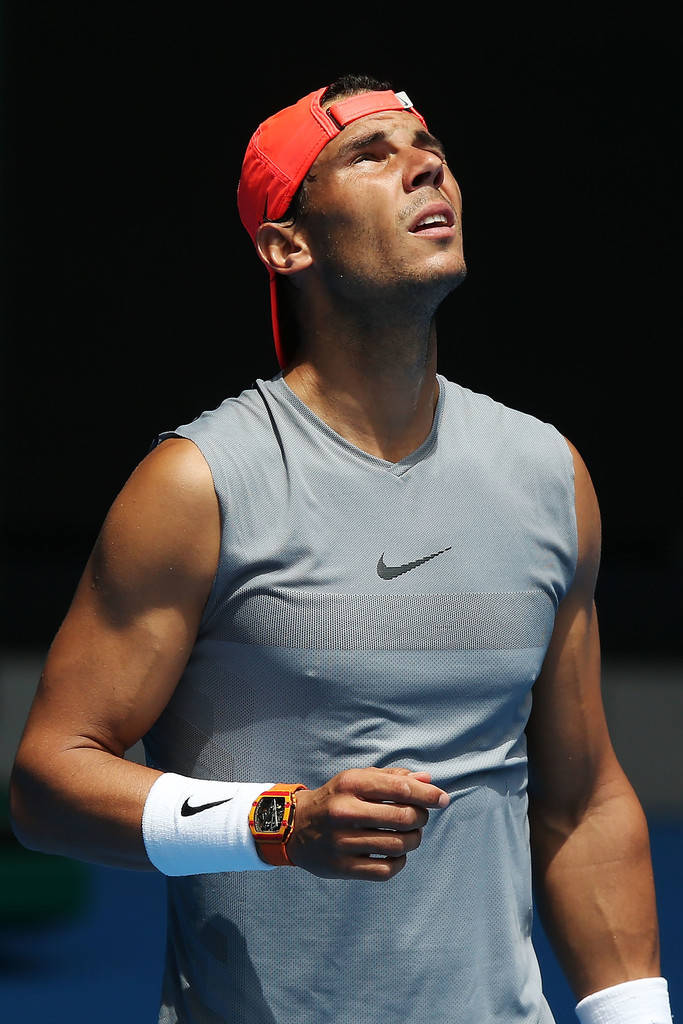 Rafael Nadal Solemnly Looking Up Background
