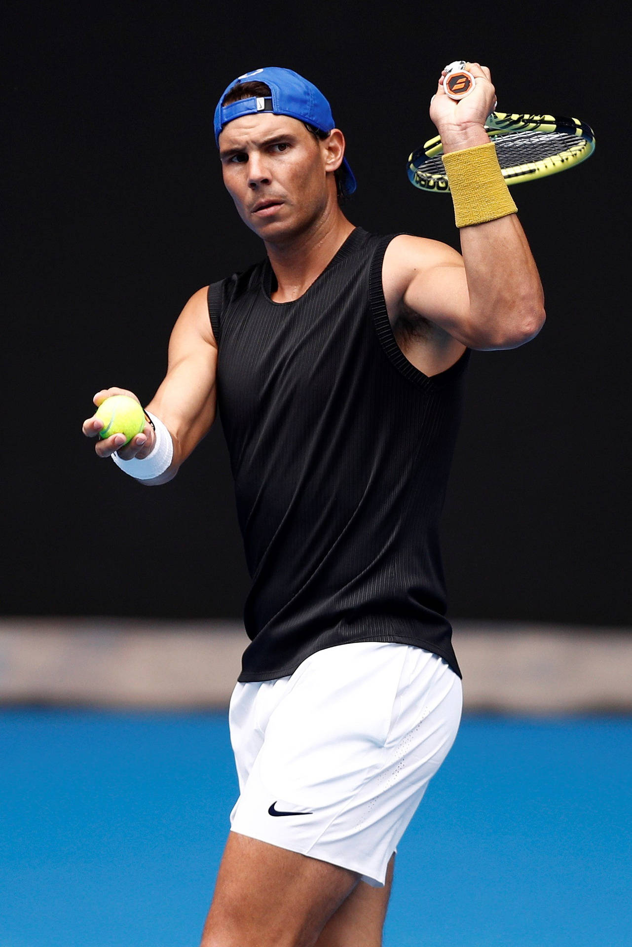 Rafael Nadal With Racket Up Background