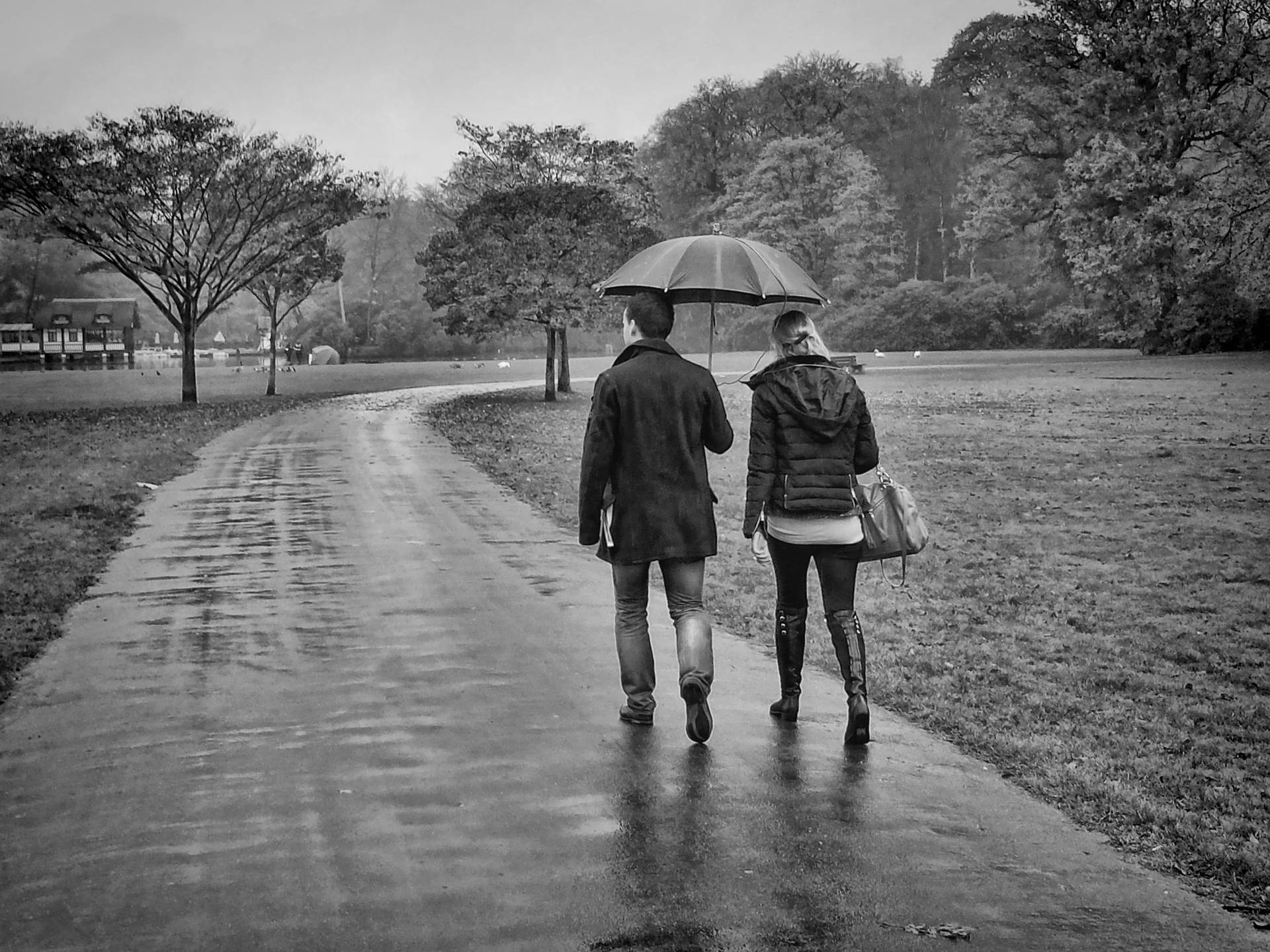 Rain Couple On Paved Road Background