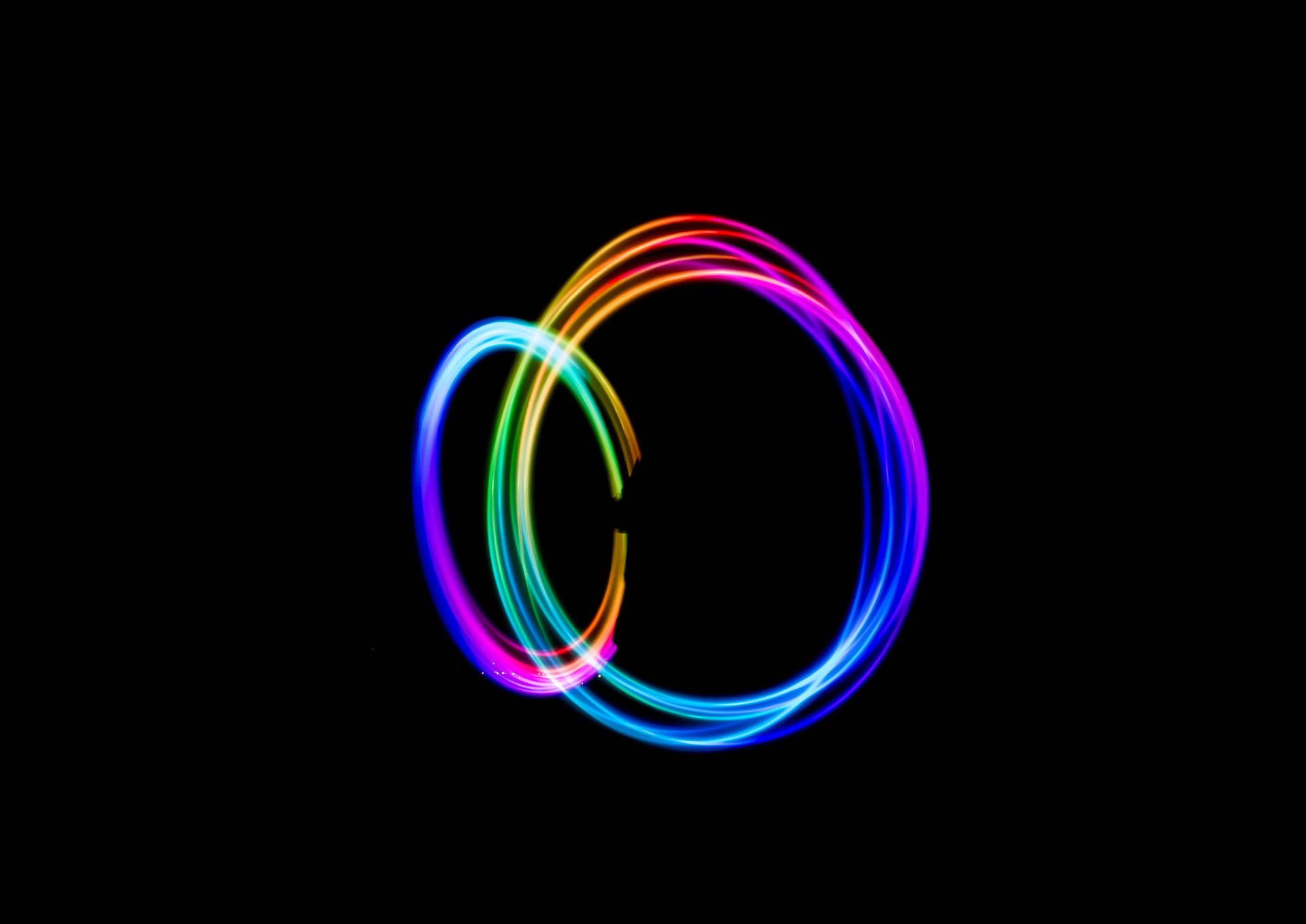 Rainbow Circles On A Dark Background Background