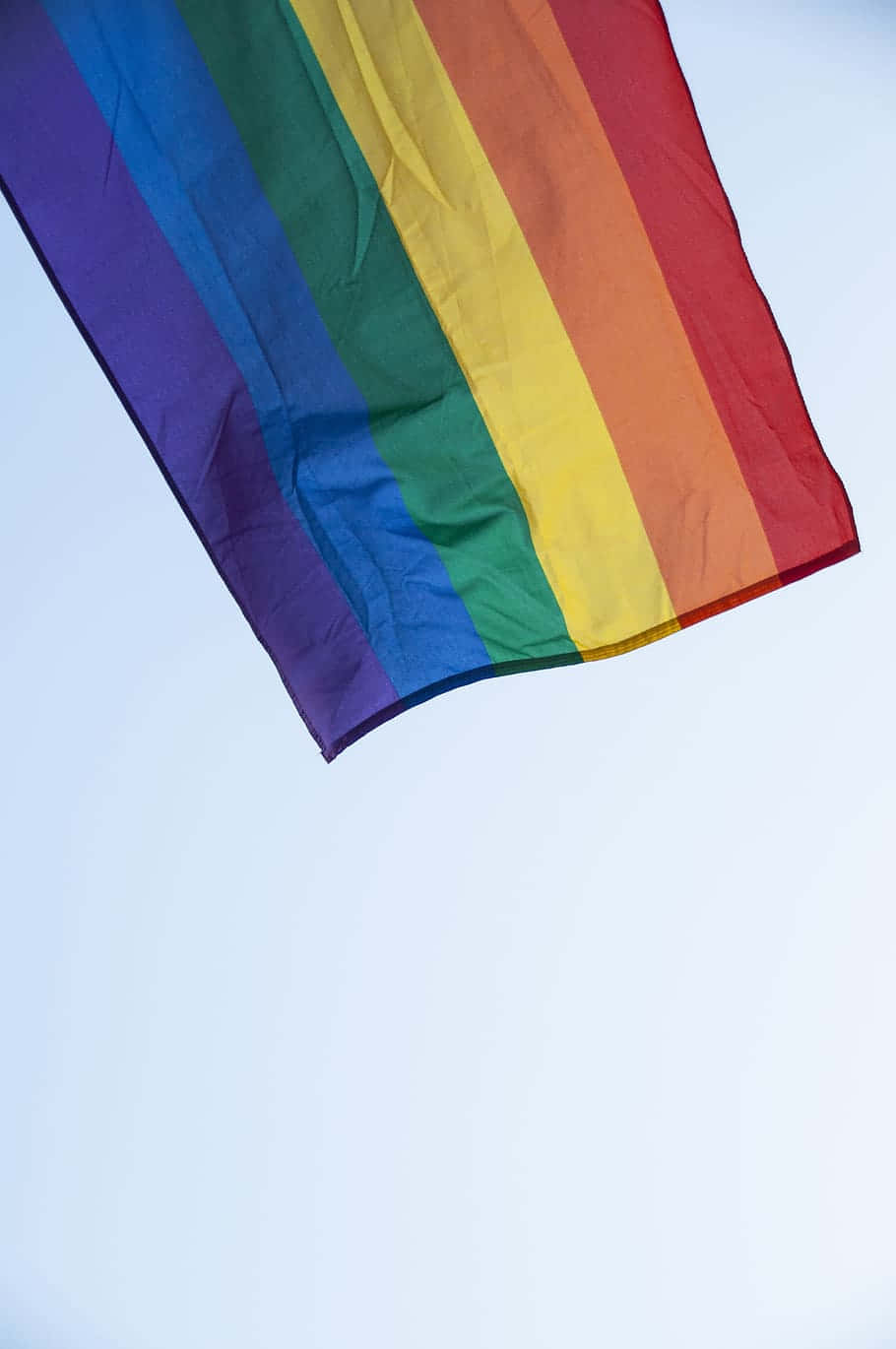 Rainbow Flag Flying In The Air Background