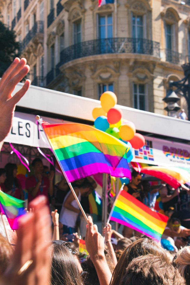 Rainbow Flag In The Air For A Black Gay Man Life Background