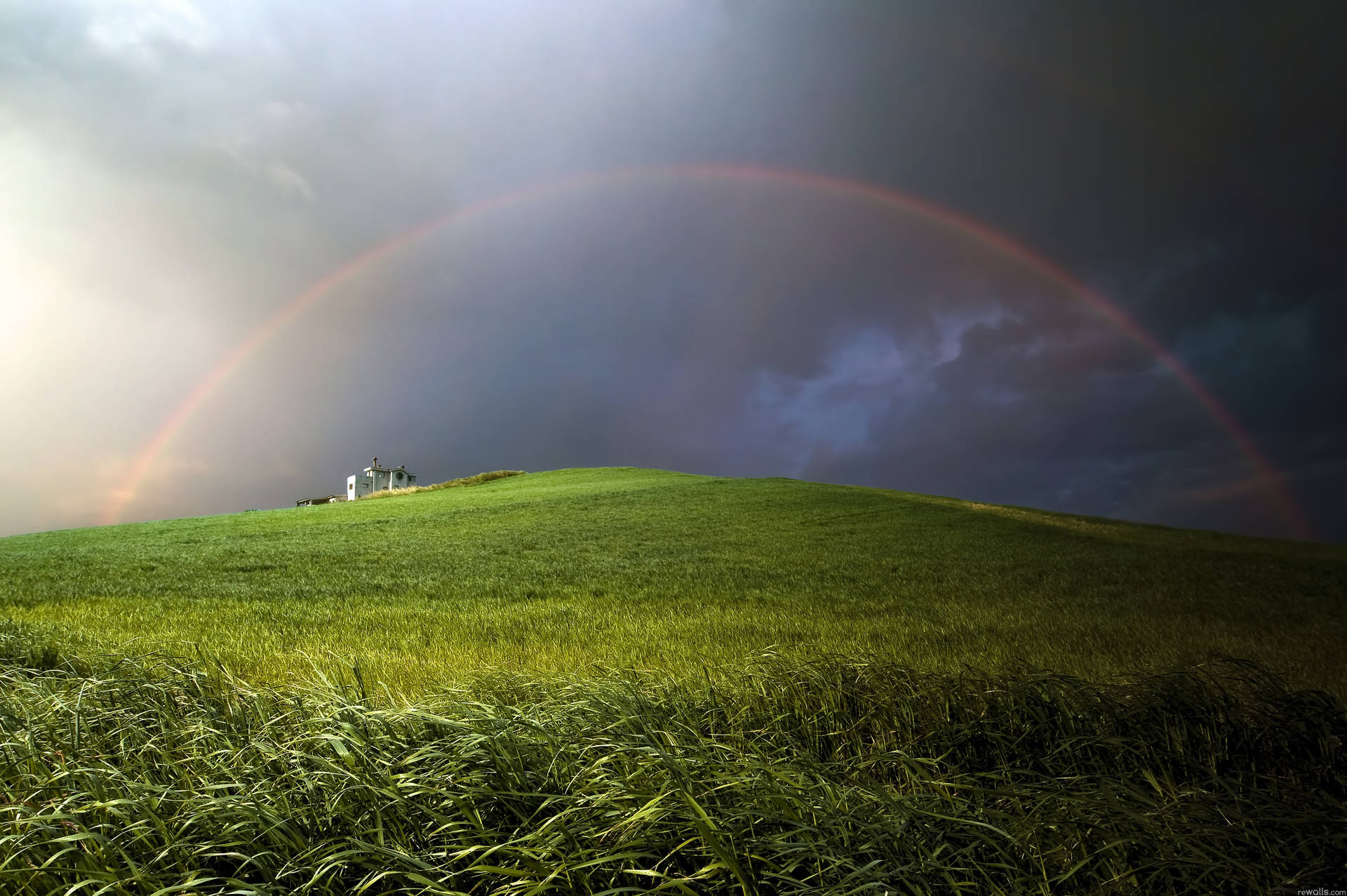 Rainbow In Hills Background